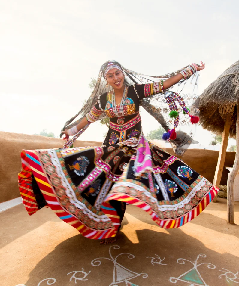 A woman dancing in the desert