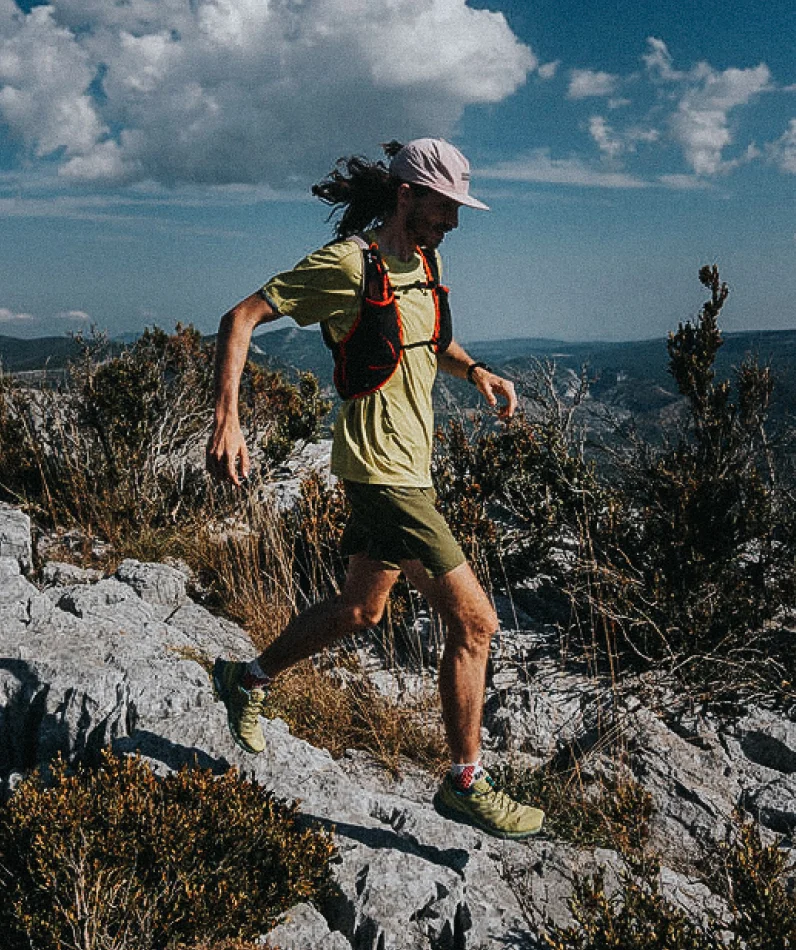 A male trail runner in the mountains