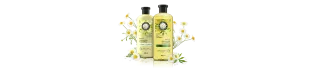 Botellas de shampoo y acondicionador para pelo sano de la colección Shine de Herbal Essences