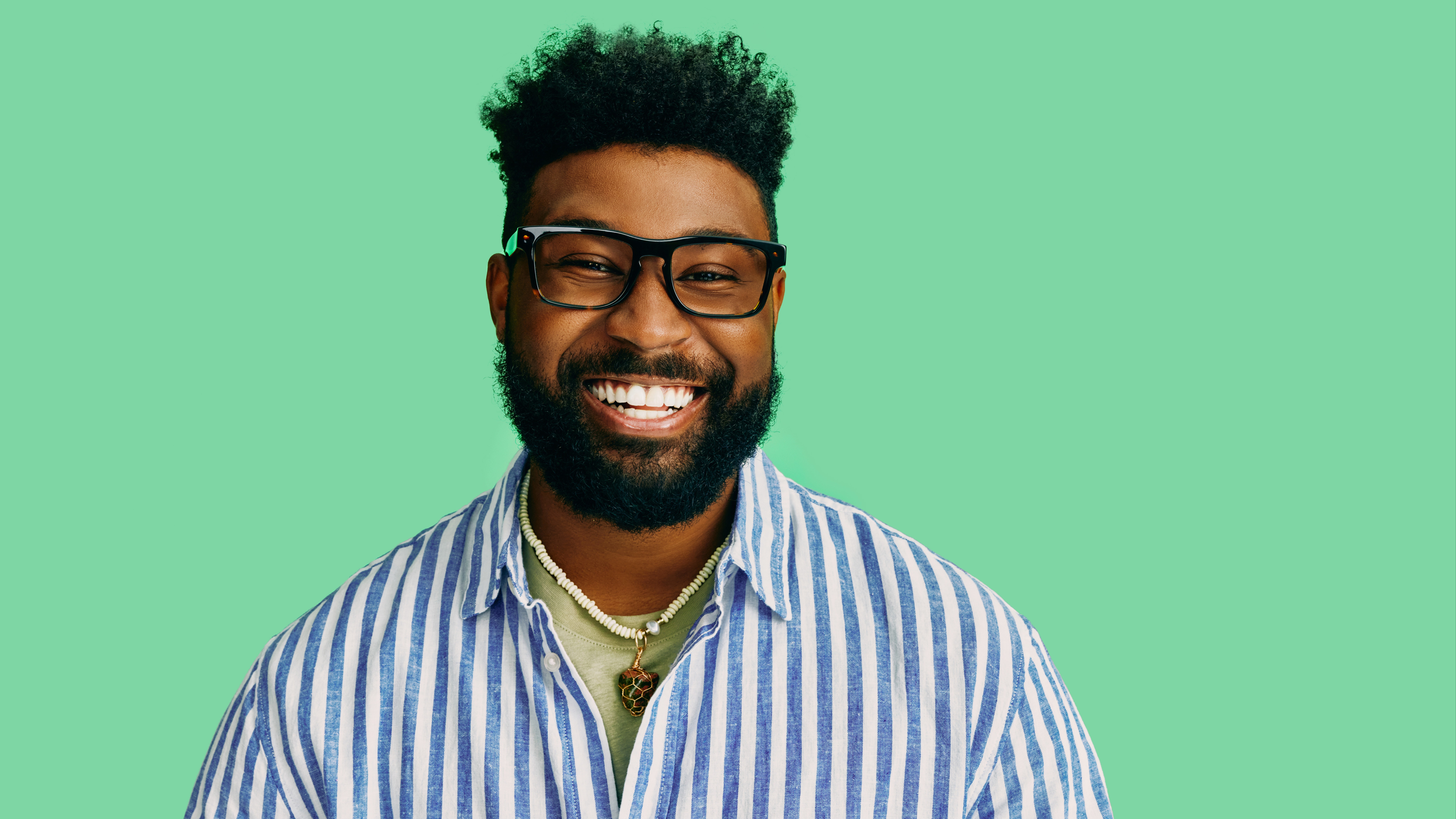 Male model with glasses - on green