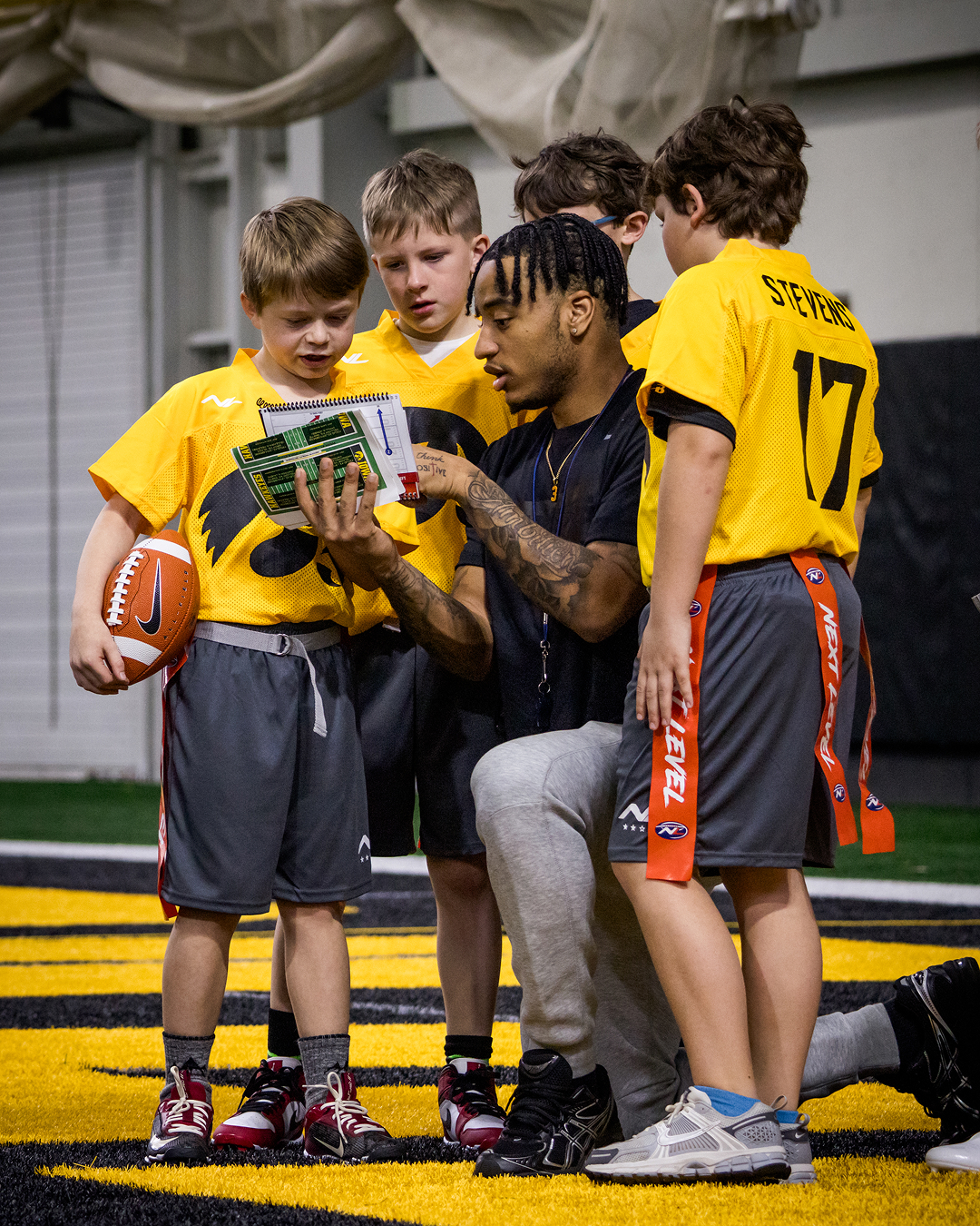 Iowa coach with young athletes