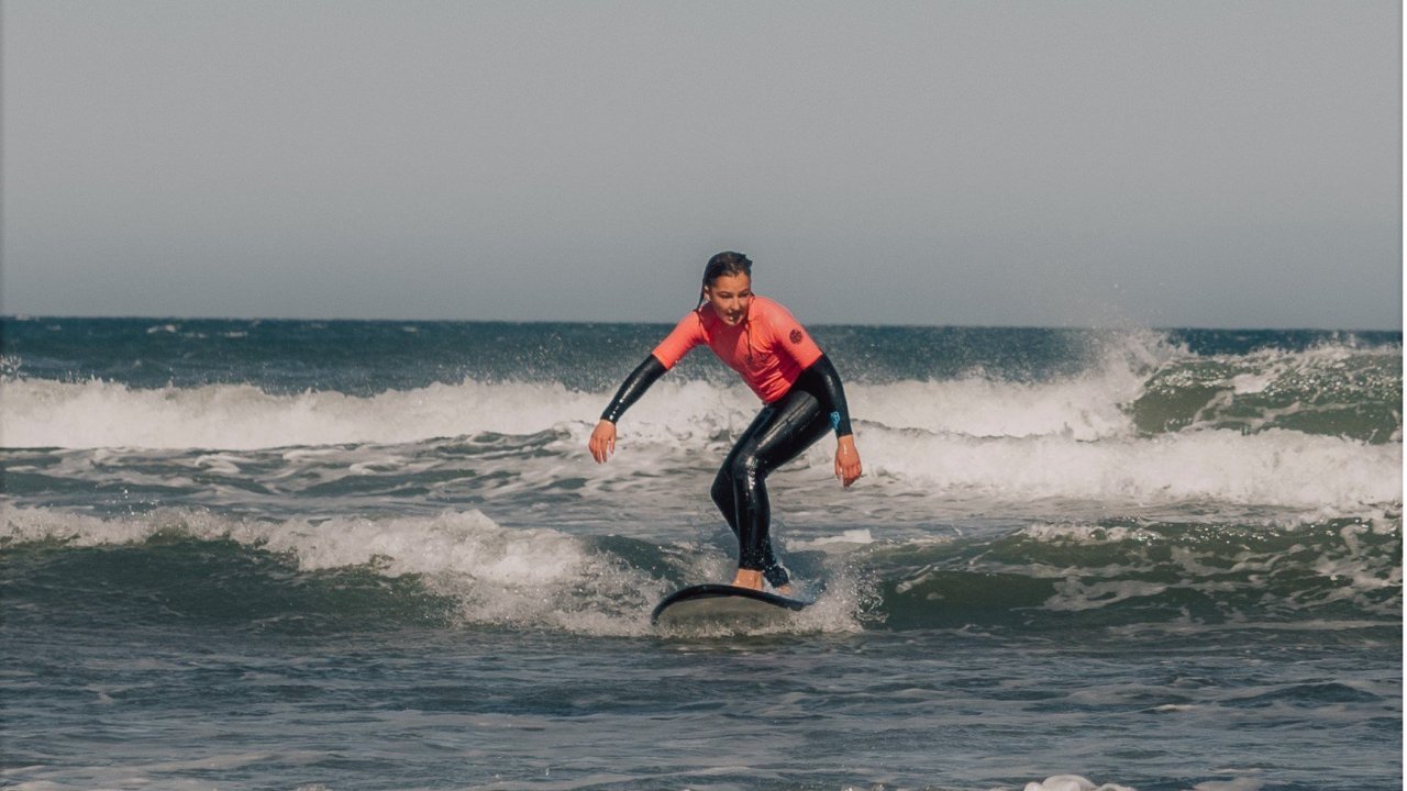 Learn to surf at Sandy Point with Offshore Surf School