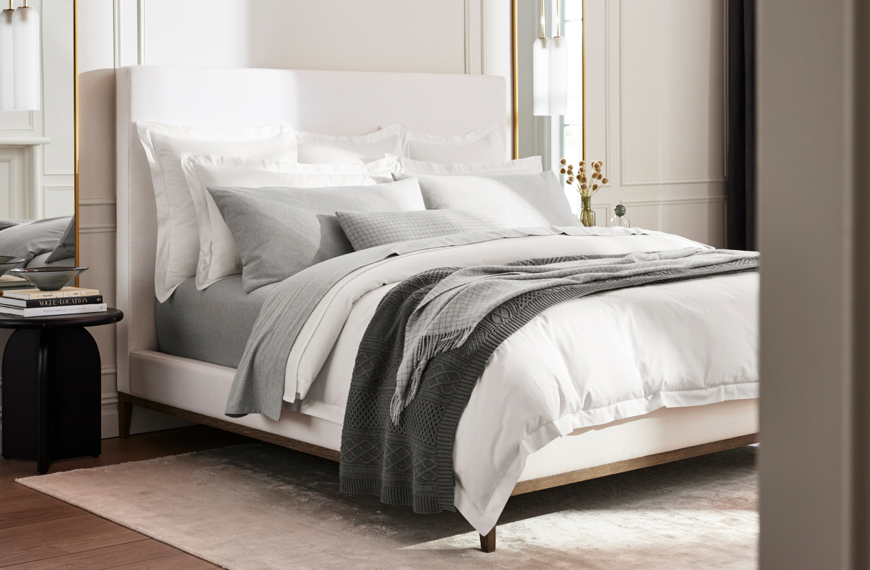 White bed with grey layers