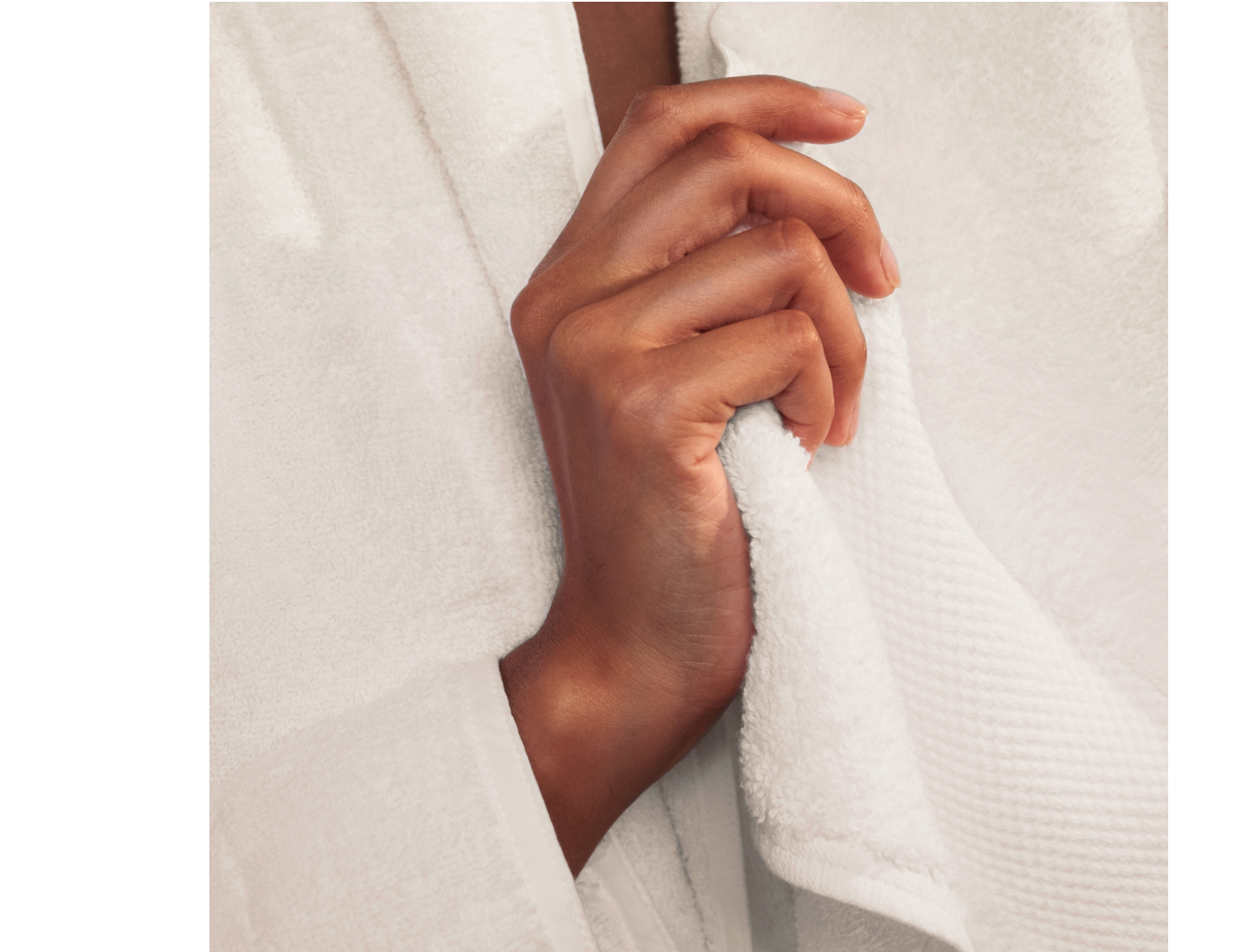 Hands holding a Plush Bath Towel