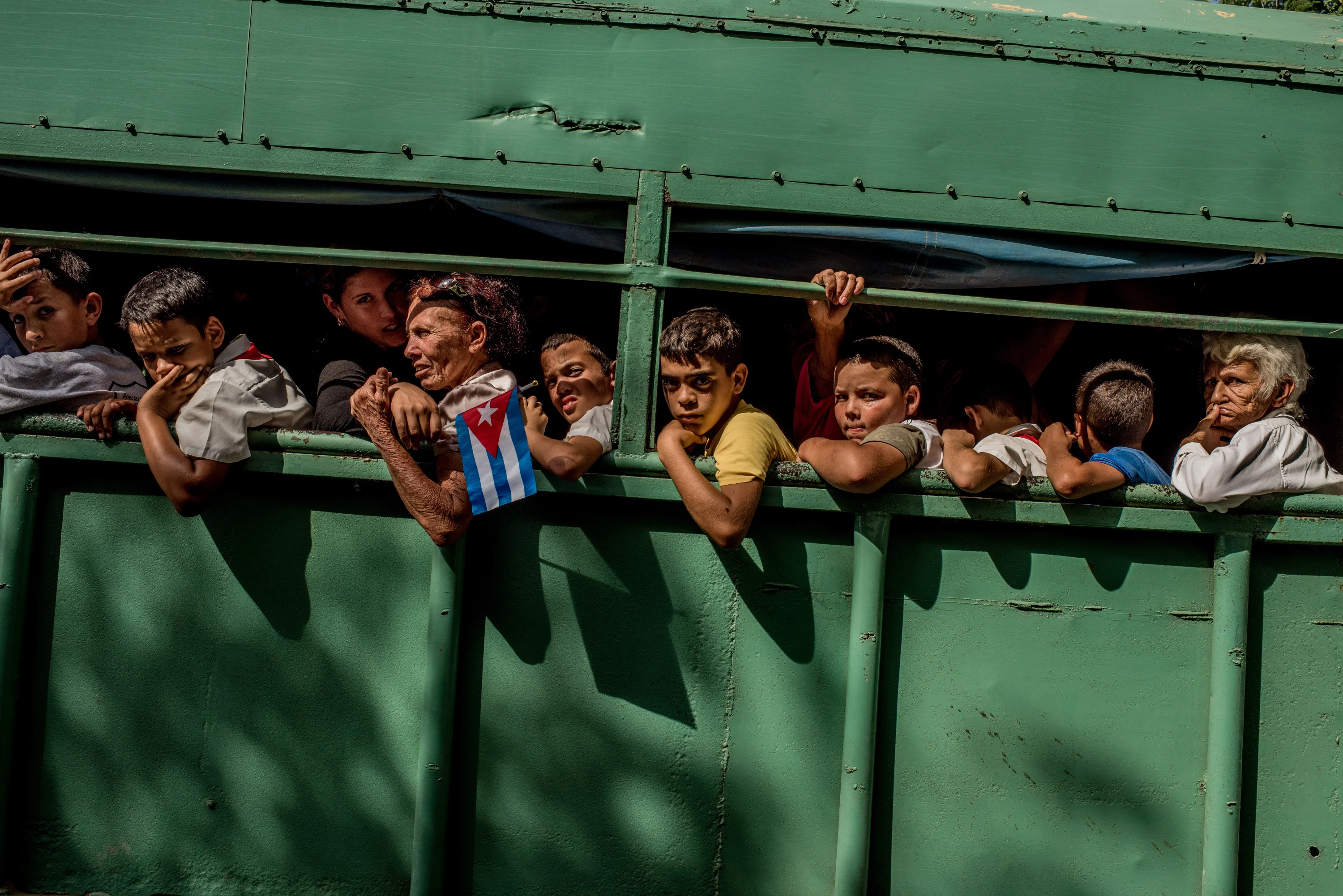 Trucks carried students home after the carriage carrying Fidel’s ashes passed in Las Tunas Province, Cuba on December 2, 2016.