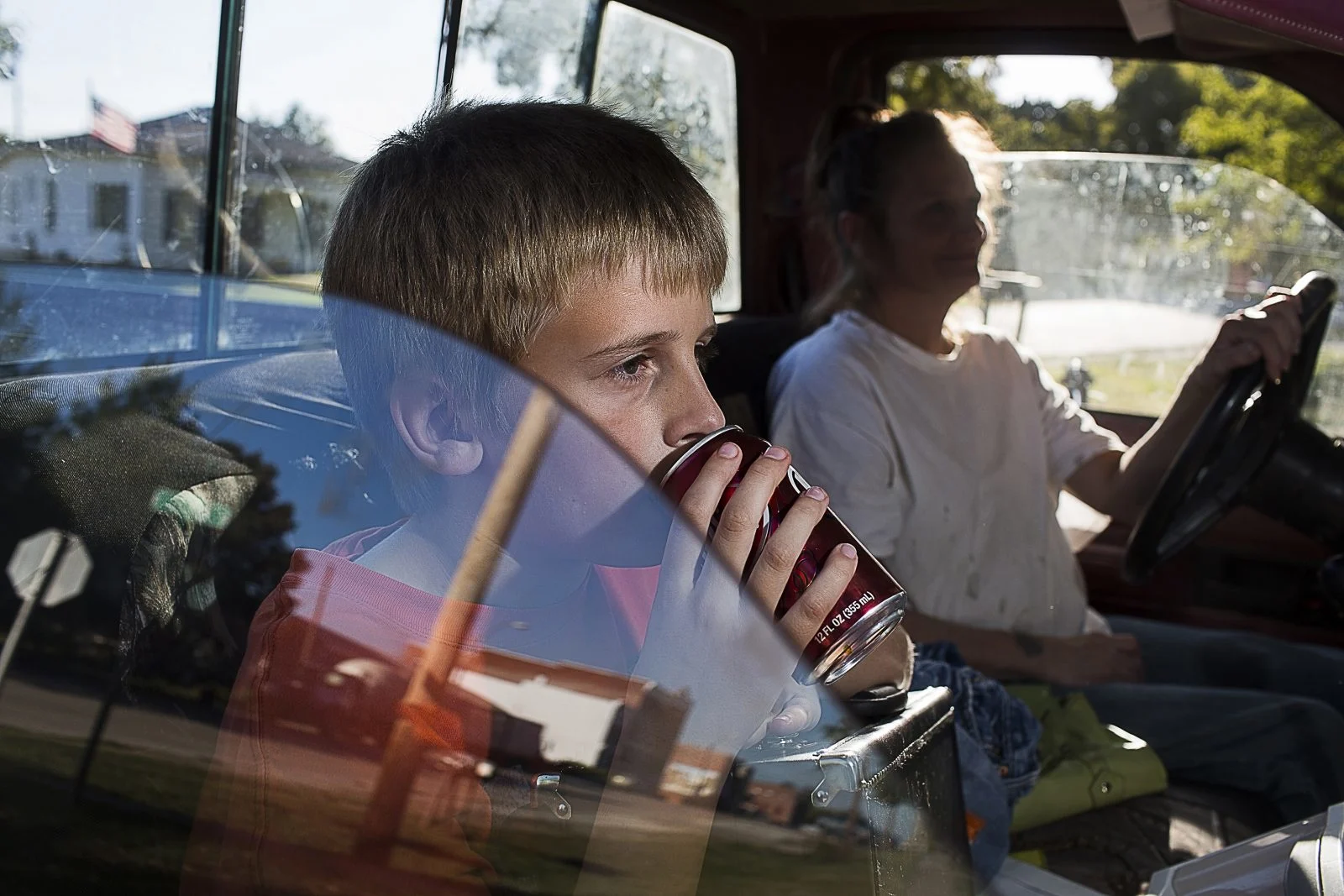 Leslie Blank Taking Her Son Joe Home from Music Lesson. Table Rock, Nebraska, United States. 9th of October 2013.