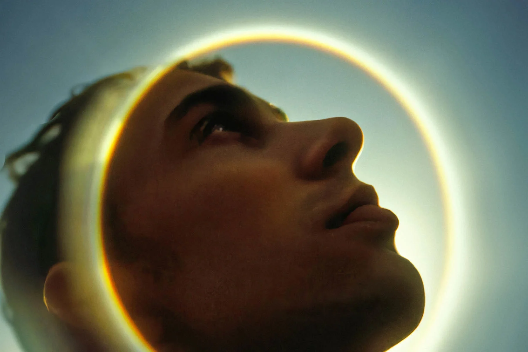 An AI-generated photograph showing a person looking up into the sky, with a halo of sunlight reflecting off the camera’s lens around their head
