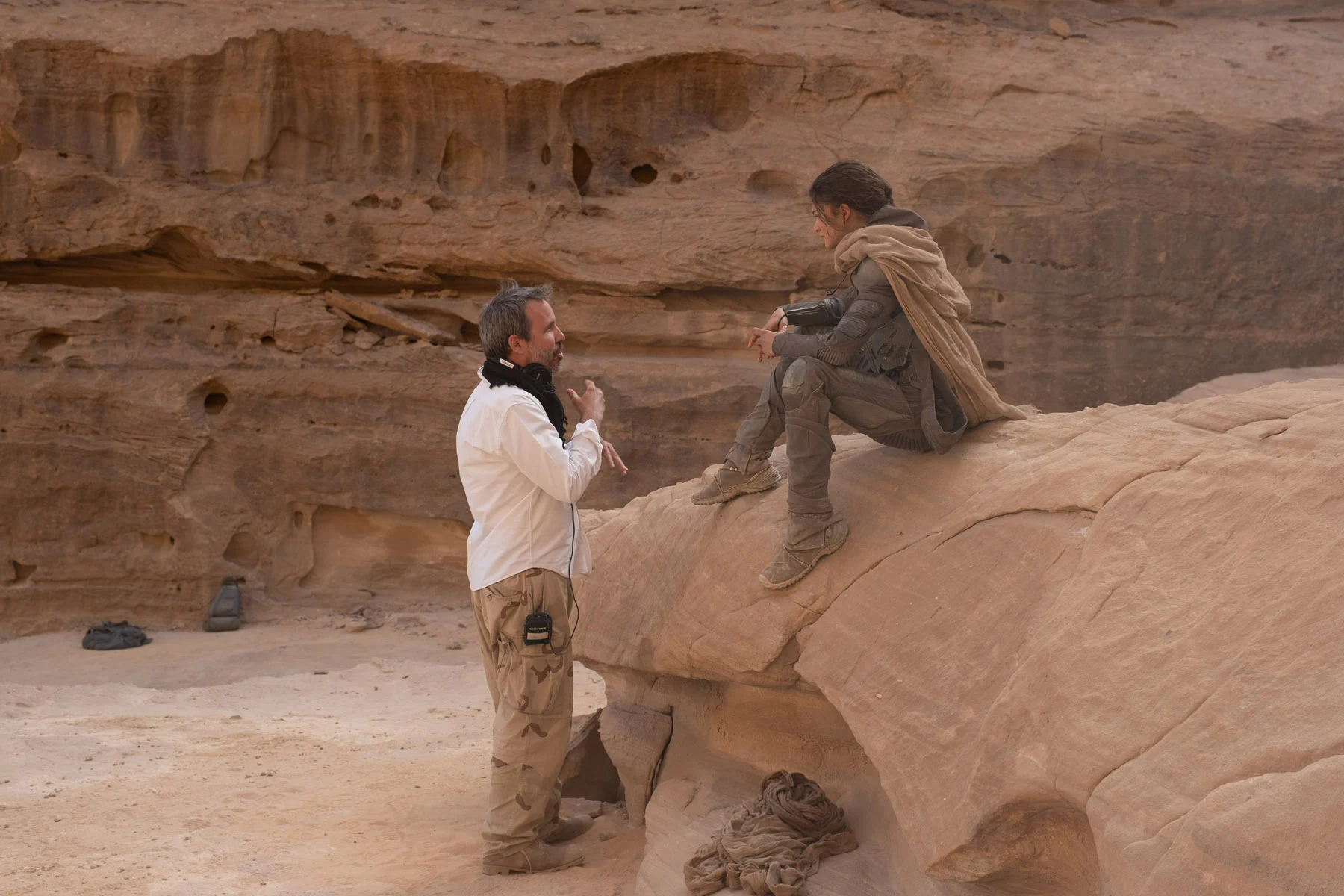 Director/co-writer/producer DENIS VILLENEUVE and ZENDAYA on the set of Warner Bros. Pictures’ and Legendary Pictures’ action adventure “DUNE,” a Warner Bros. Pictures and Legendary release. Photo by Chiabella James