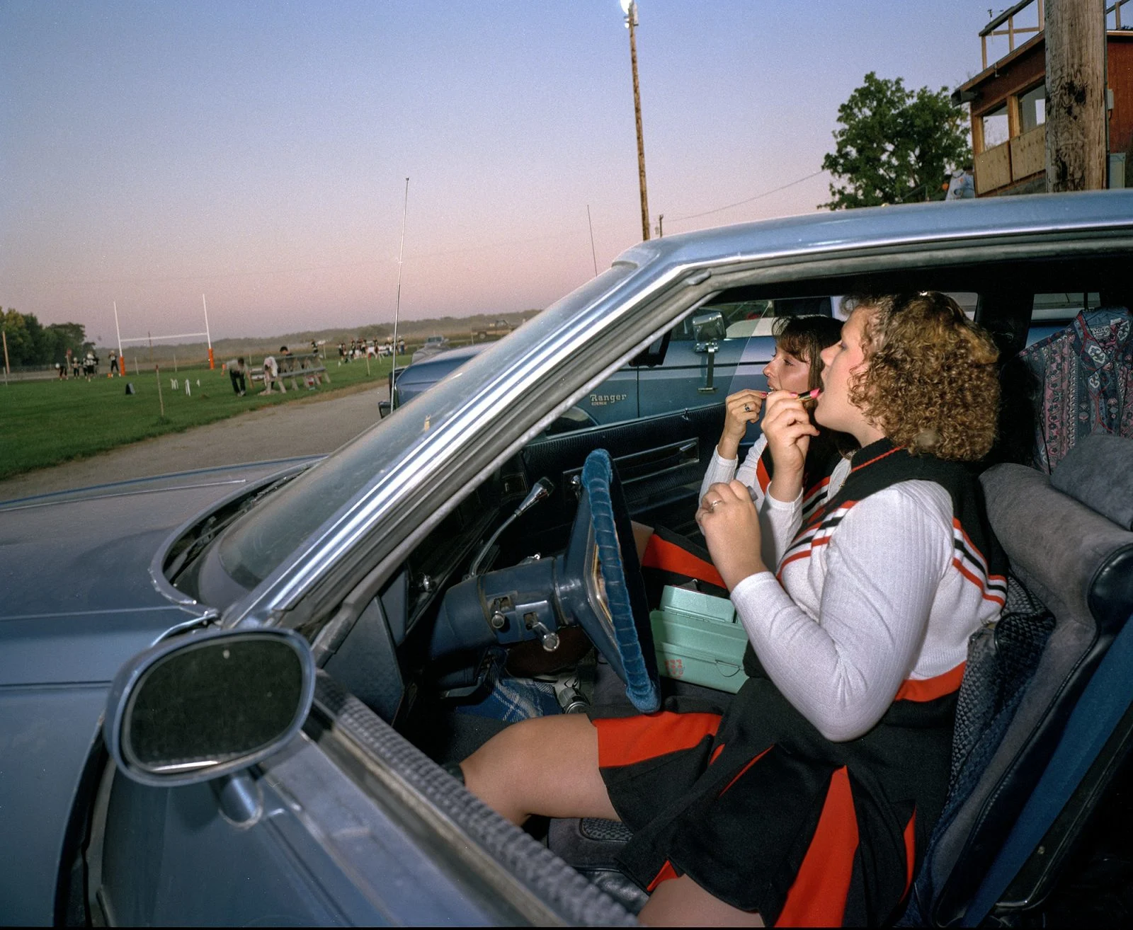 Cheerleaders Melissa Bernadt and Jennifer Burnedt Preparing for the Evenings Homecoming Game. Table Rock, Nebraska, United States. September 1992.