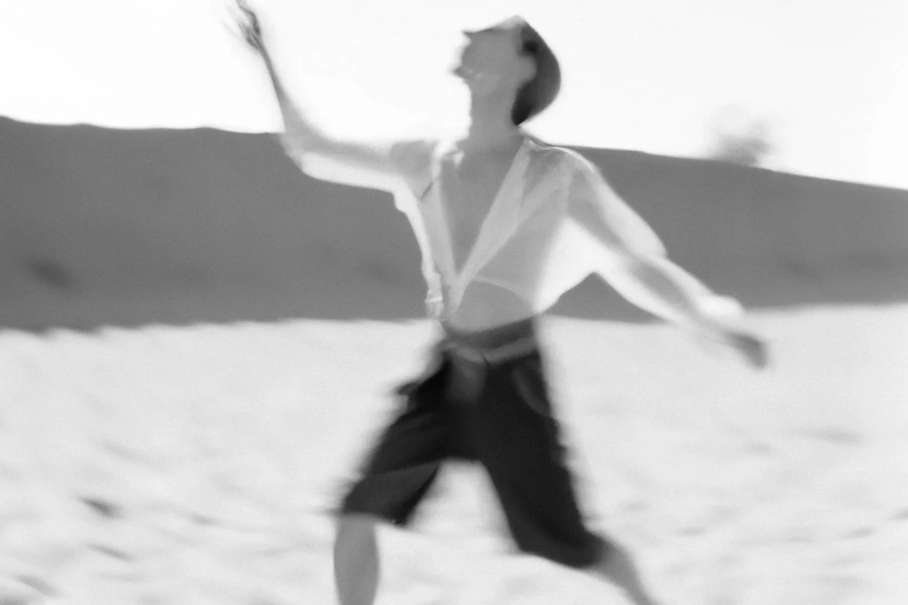 A black-and-white AI-generated photograph of a person dancing 