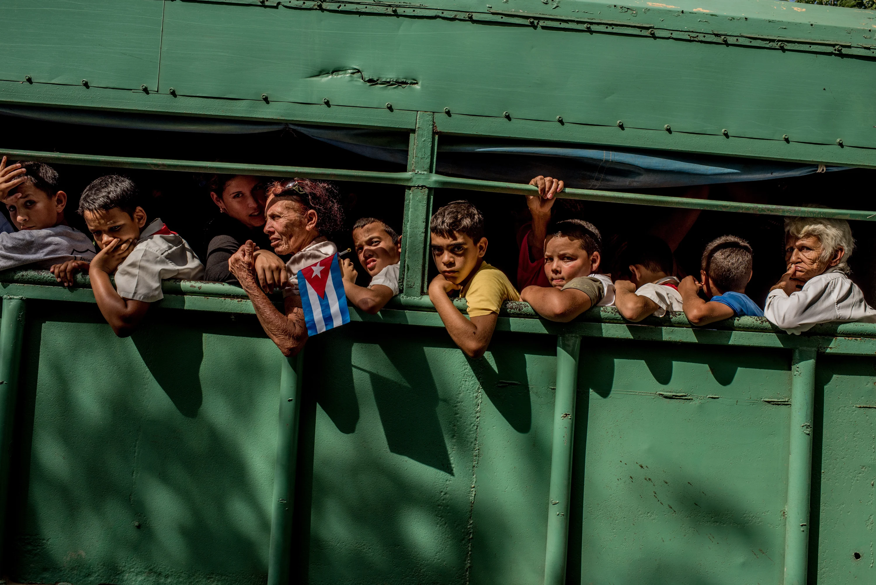 Trucks carried students home after the carriage carrying Fidel's ashes passed in Las Tunas Province, Cuba on December 2, 2016. Cuba declared nine days of mourning after Fidel CastroÕs death, a period that culminated with his funeral.