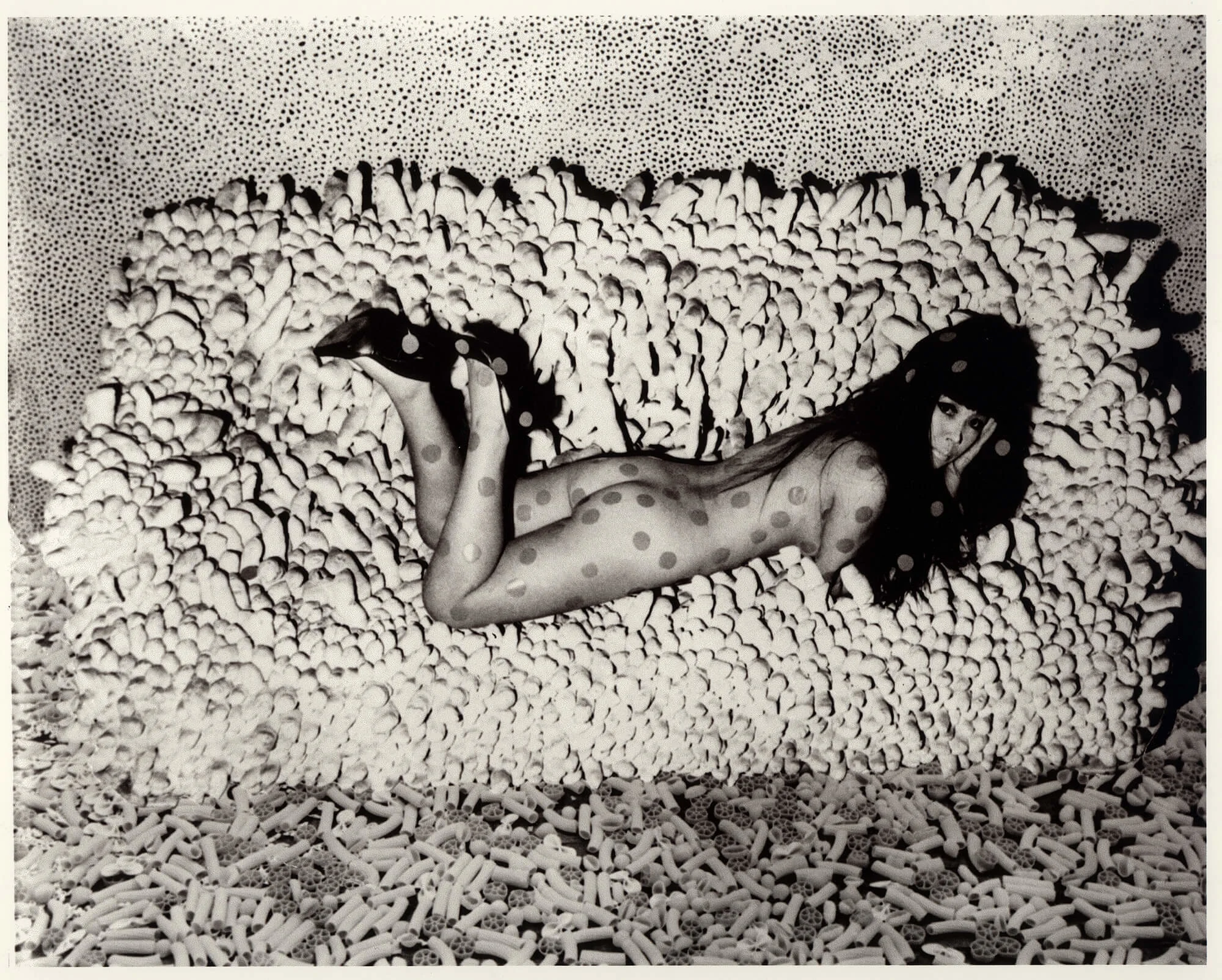 Untitled, c.1966. Photo collage, Kusama reclining on Accumulation No.2