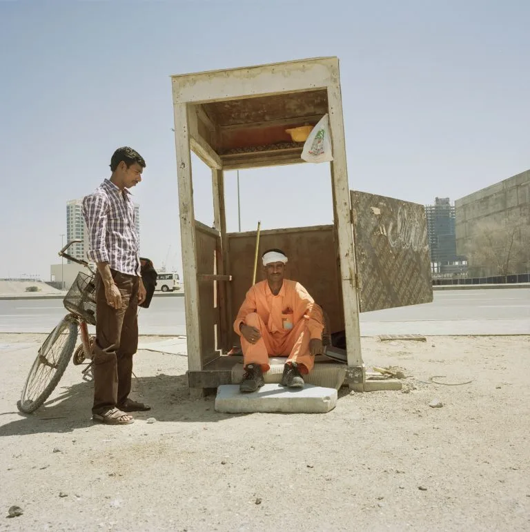 Olivia Arthur. Workers take a break from a construction site in Dubai Business Bay. Dubai, United Arab Emirates (2014).