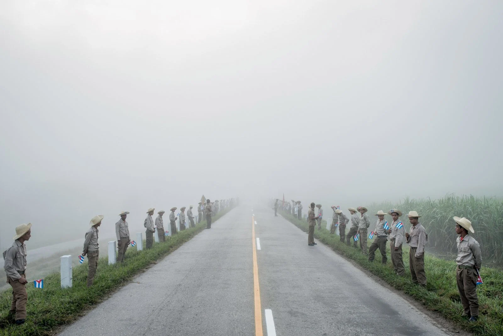 Members of the Ejercito Juvenil del Trabajo waited along the road to Santiago de Cuba at dawn for Fidel Castro’s caravan on December 3, 2016.