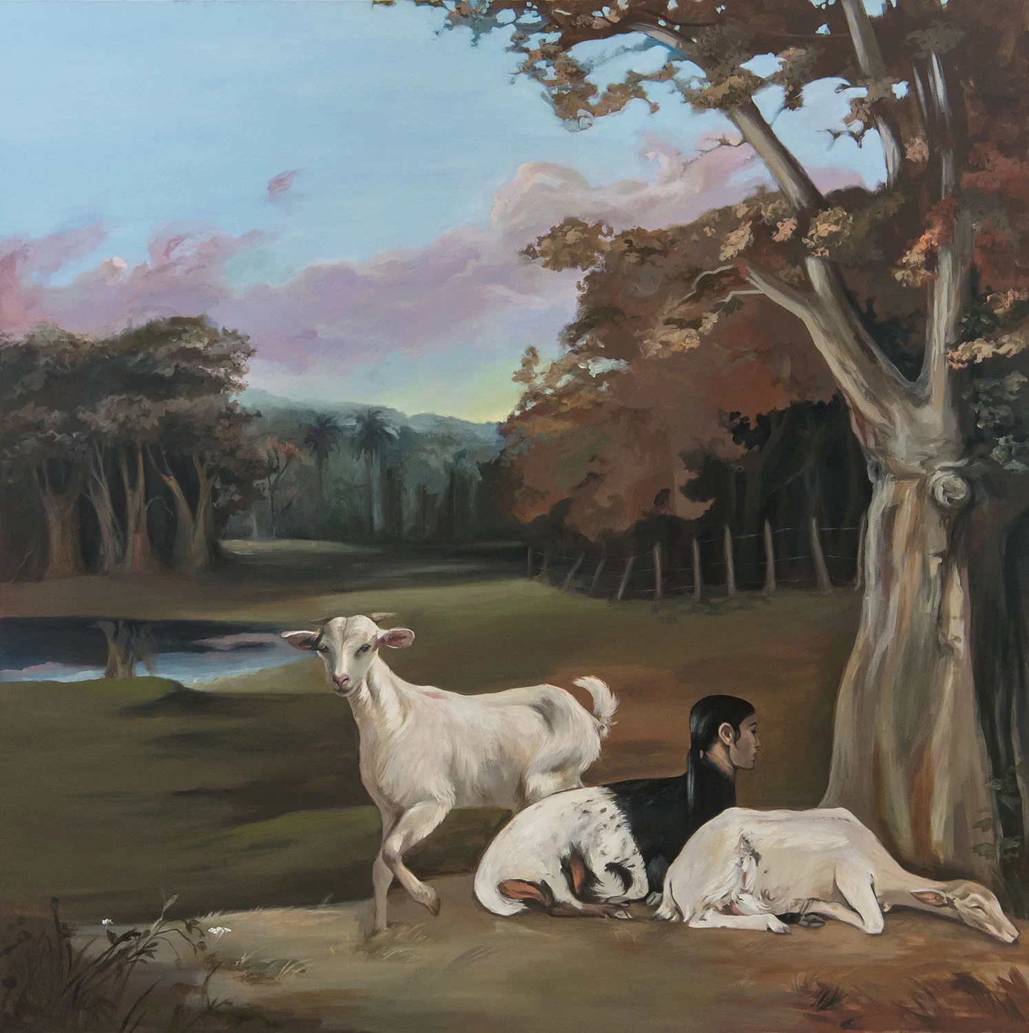 An acrylic painting depicting a chimera with the body of a multicolored goat and the head of an Arabic woman, sitting between two white goats in front of a vernacular wooded landscape.