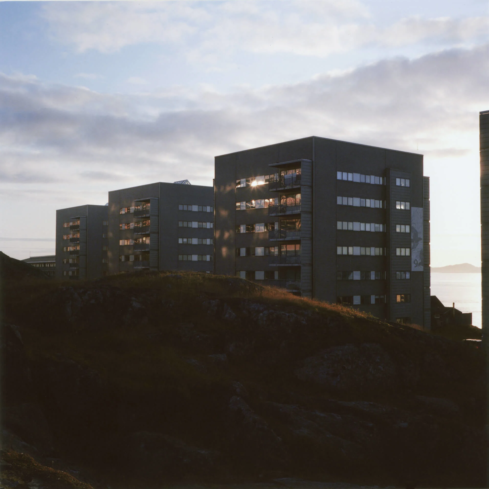 Examples of Nuuk’s modern architecture, taken by the sea at sunset. | At Tivoli Nuuk, a funfair in the center of town.