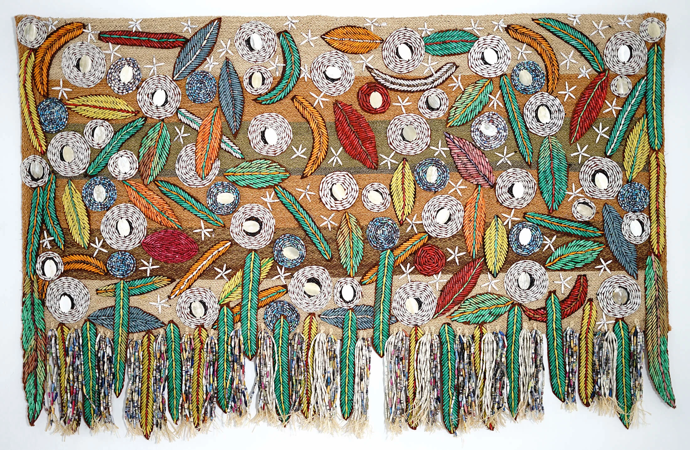 Protection, 2019 (Paperbeads on bark cloth) and Winds of change, 2021 (Paper Beads on bark cloth and sisal) 