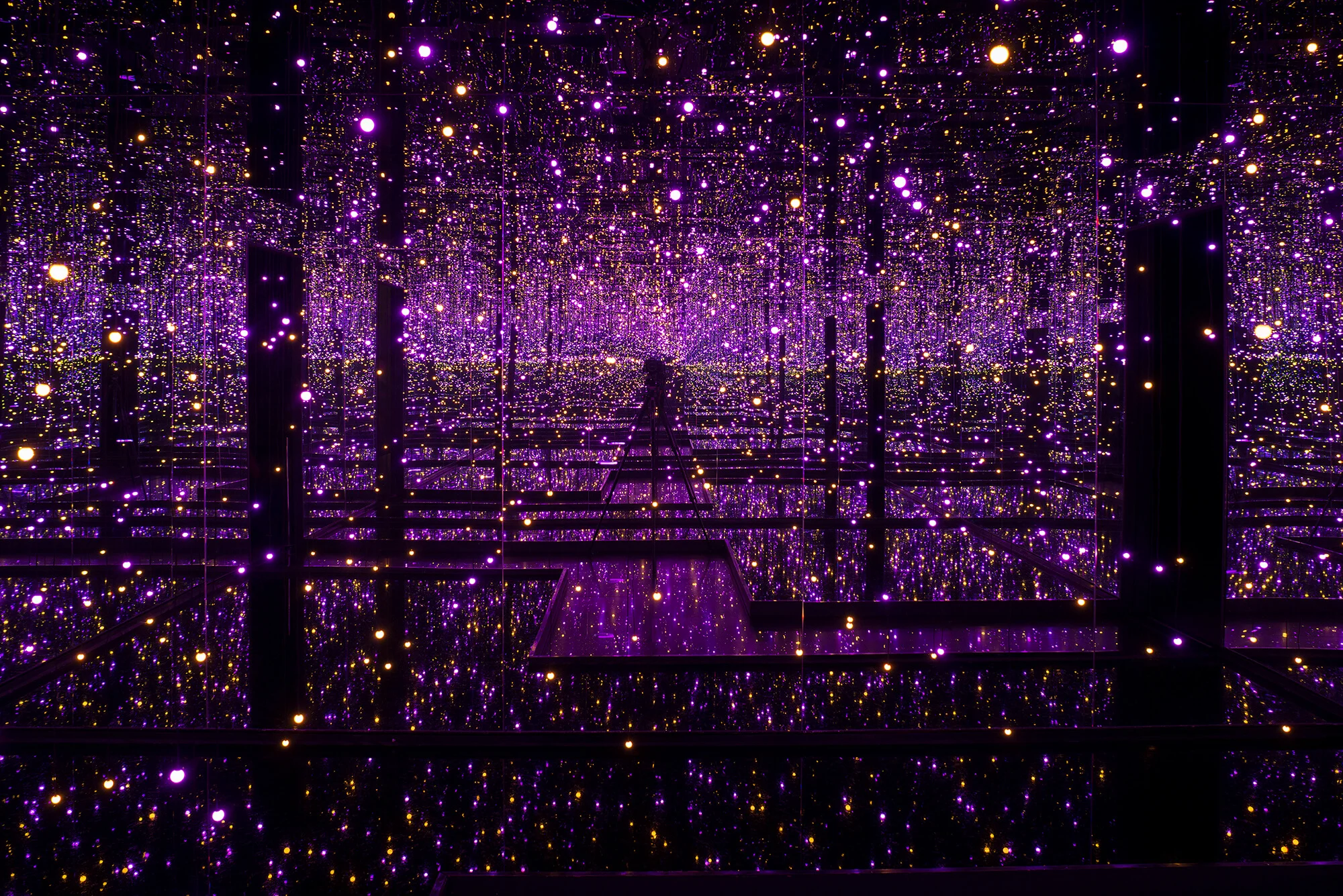 Yayoi Kusama Infinity Mirrored Room, Filled with the Brilliance of Life, 2011. Room with mirror, LED lights, water pool. 296 x 622.4 x 622.4 cm, 116 1/2 x 245 1/8 x 245 1/8 in