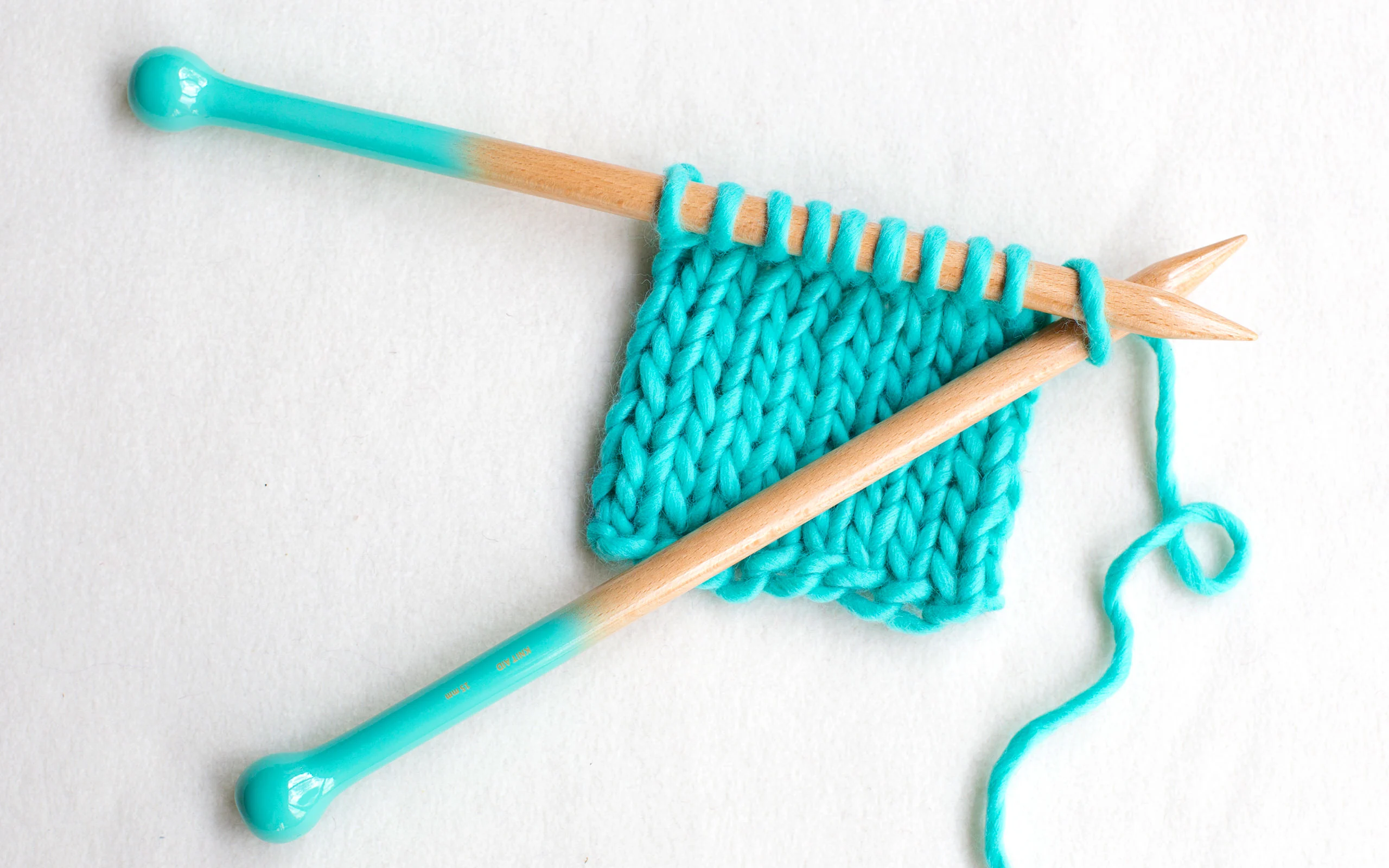 Handmade knitting gear offered by Knit Aid