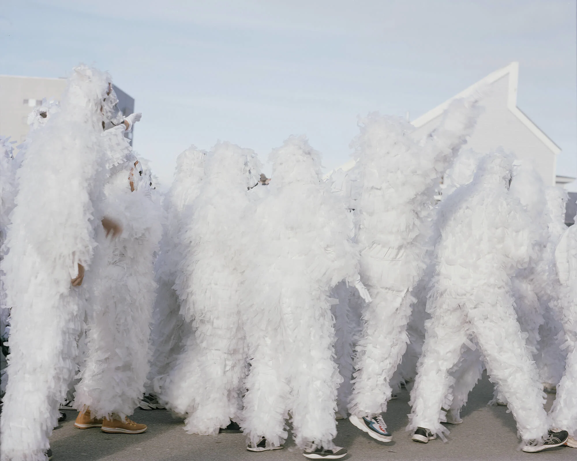 A parade of people dressed as polar bears during a carnival in Nuuk.