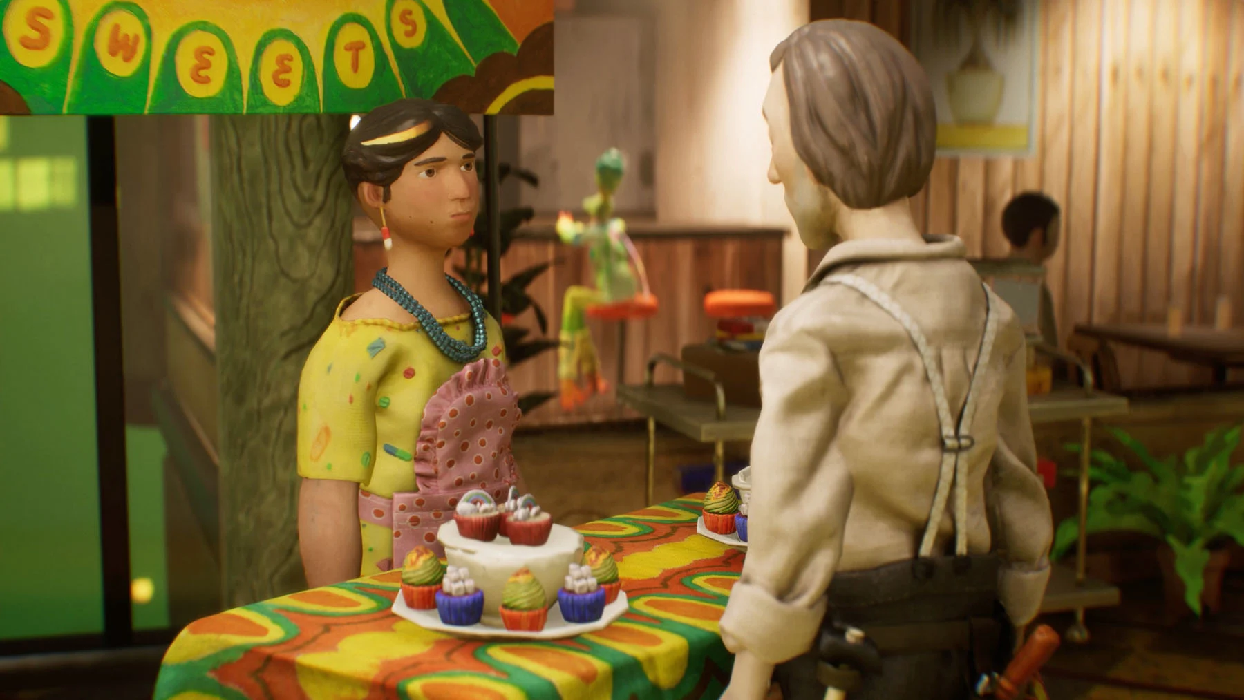 A still from the handmade video game Harold Halibut. The still shows a man and a woman talking over a table that holds a plate of cupcakes.