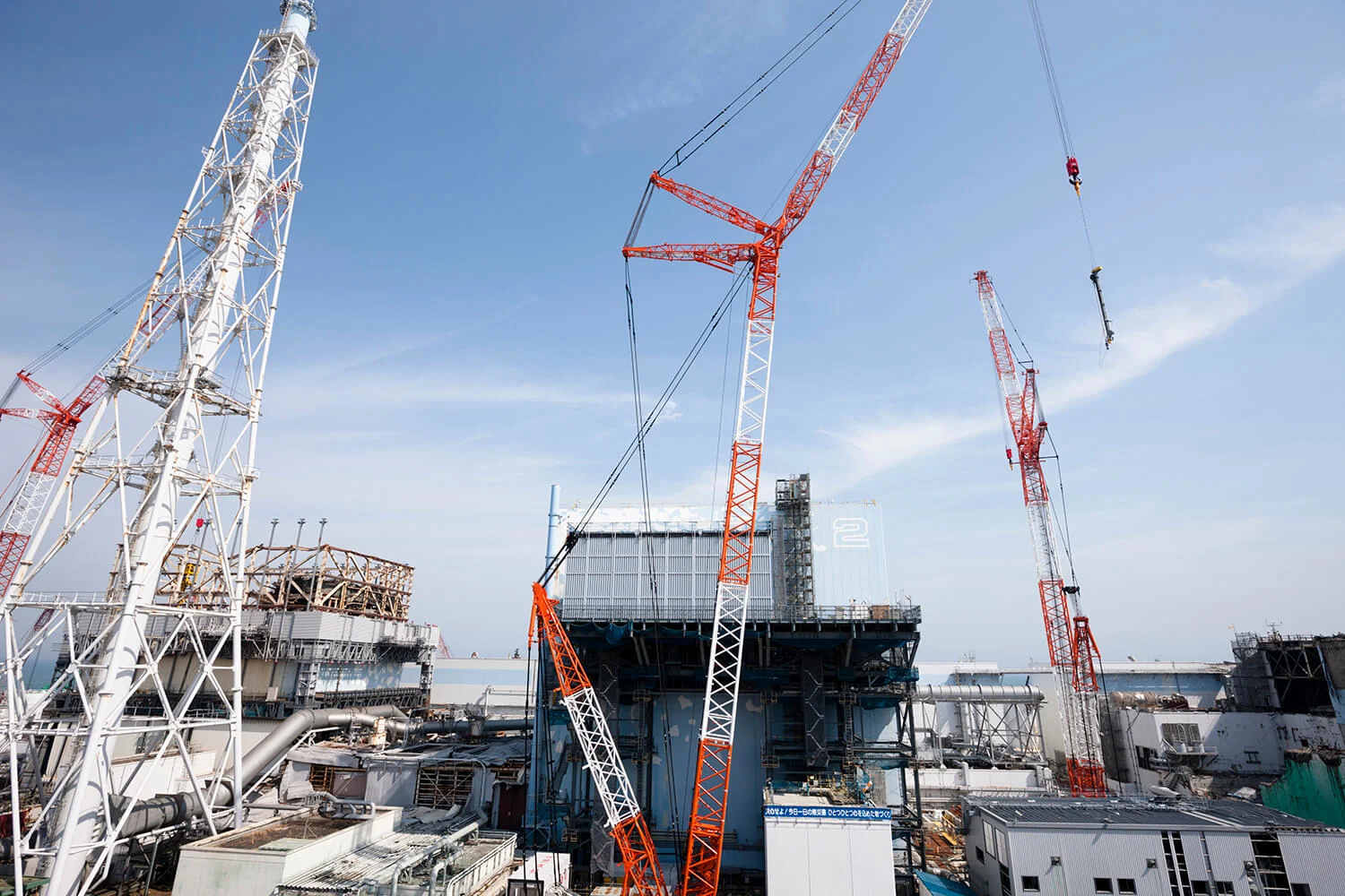 Unit 1 and Unit 2, shot in March 2018. Debris was being removed from Unit 1, while preparation work was underway for inspecting inside of Unit 2. Not in the image is Unit 3, where the cover was placed for removing nuclear fuel.