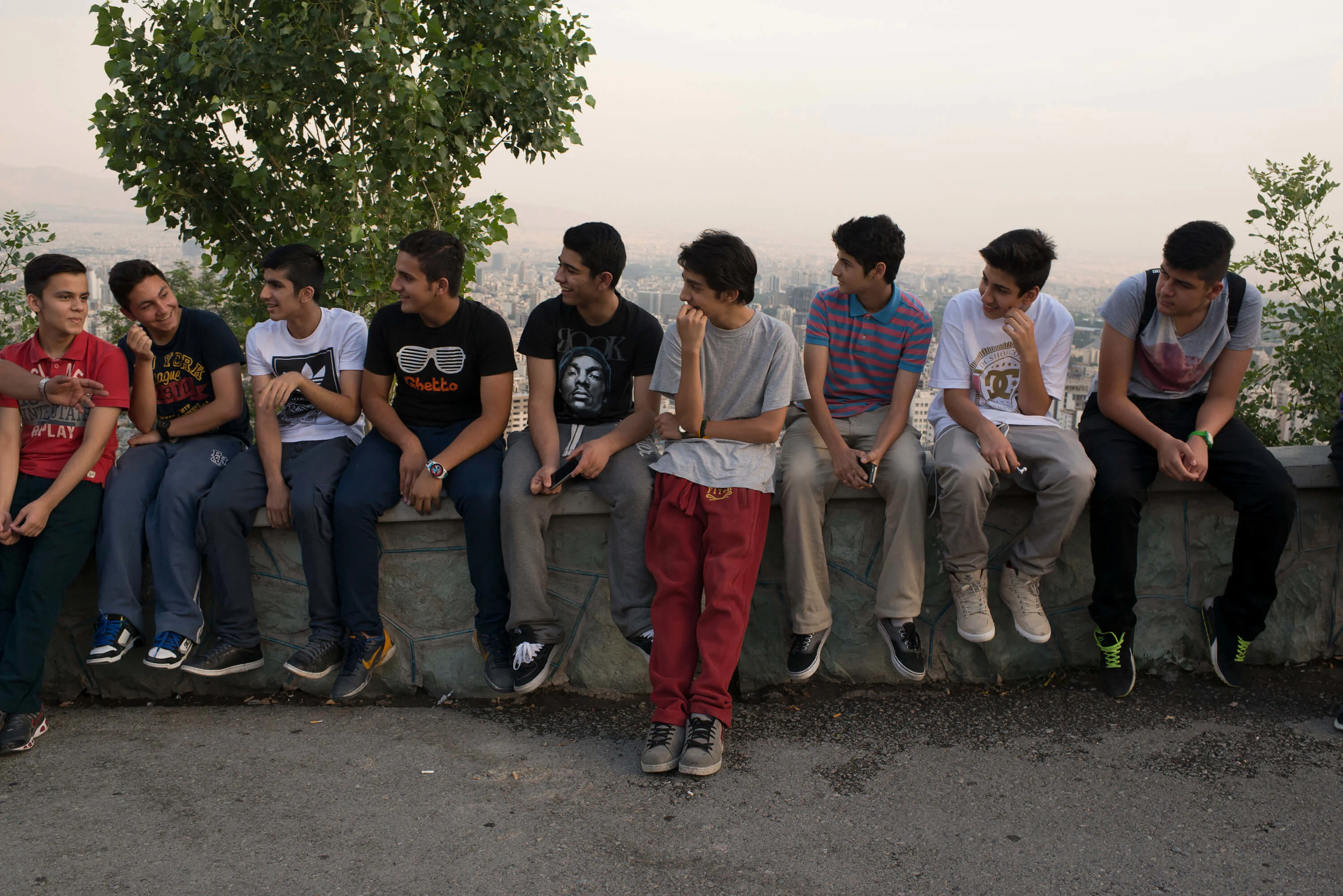 A group of teenage boys hang out at Baam e Tehran (the Roof of Tehran) during No Rouz holiday, which marks the beginning of Iranian new year.
