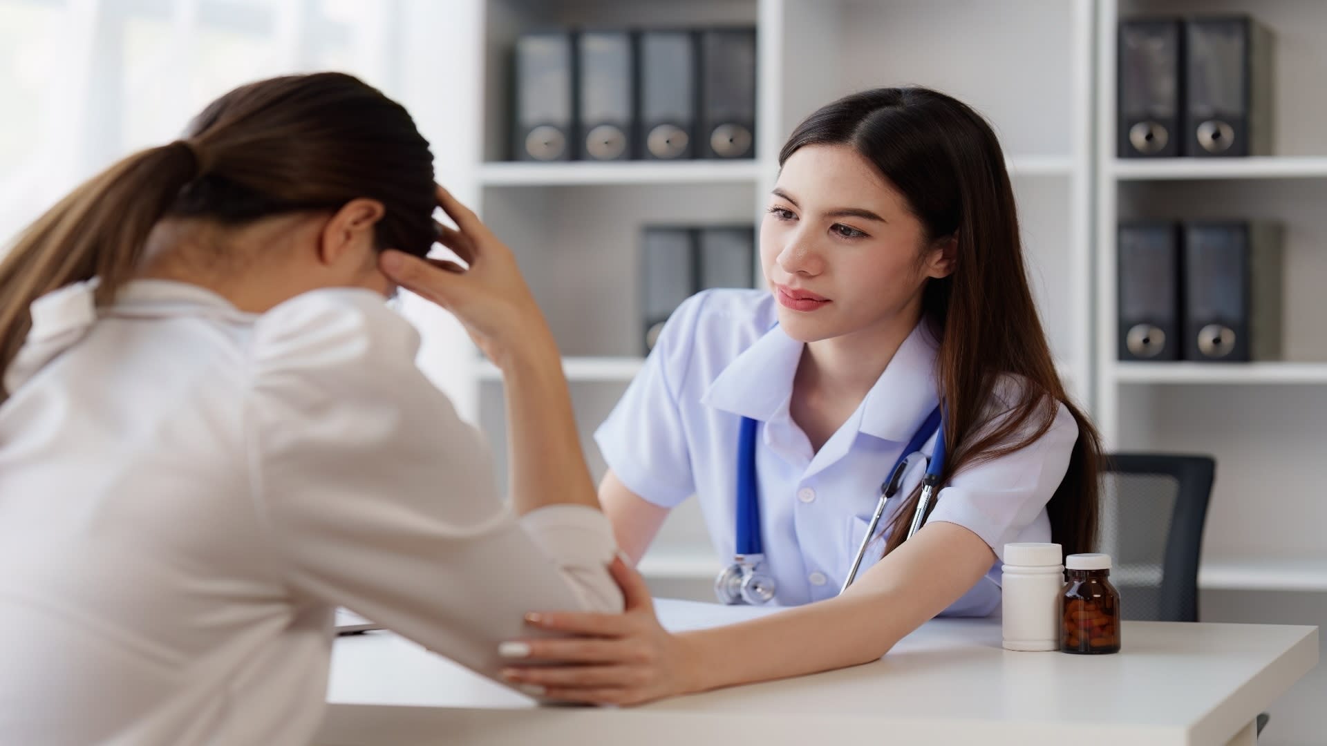 doctor-holding-hand-patient-woman-at-clinic-healt-2025-02-18-05-37-10-utc