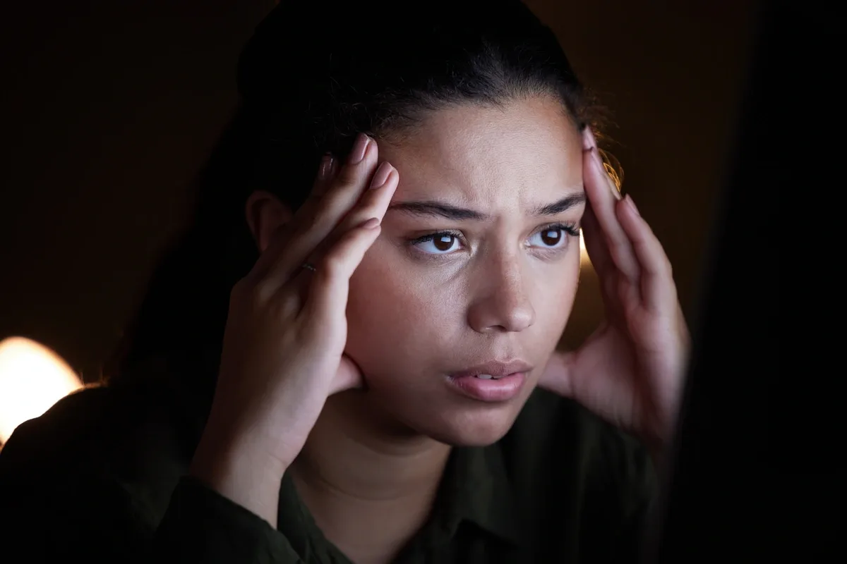 Woman in Need of Crisis Stabilization Sitting in the Dark
