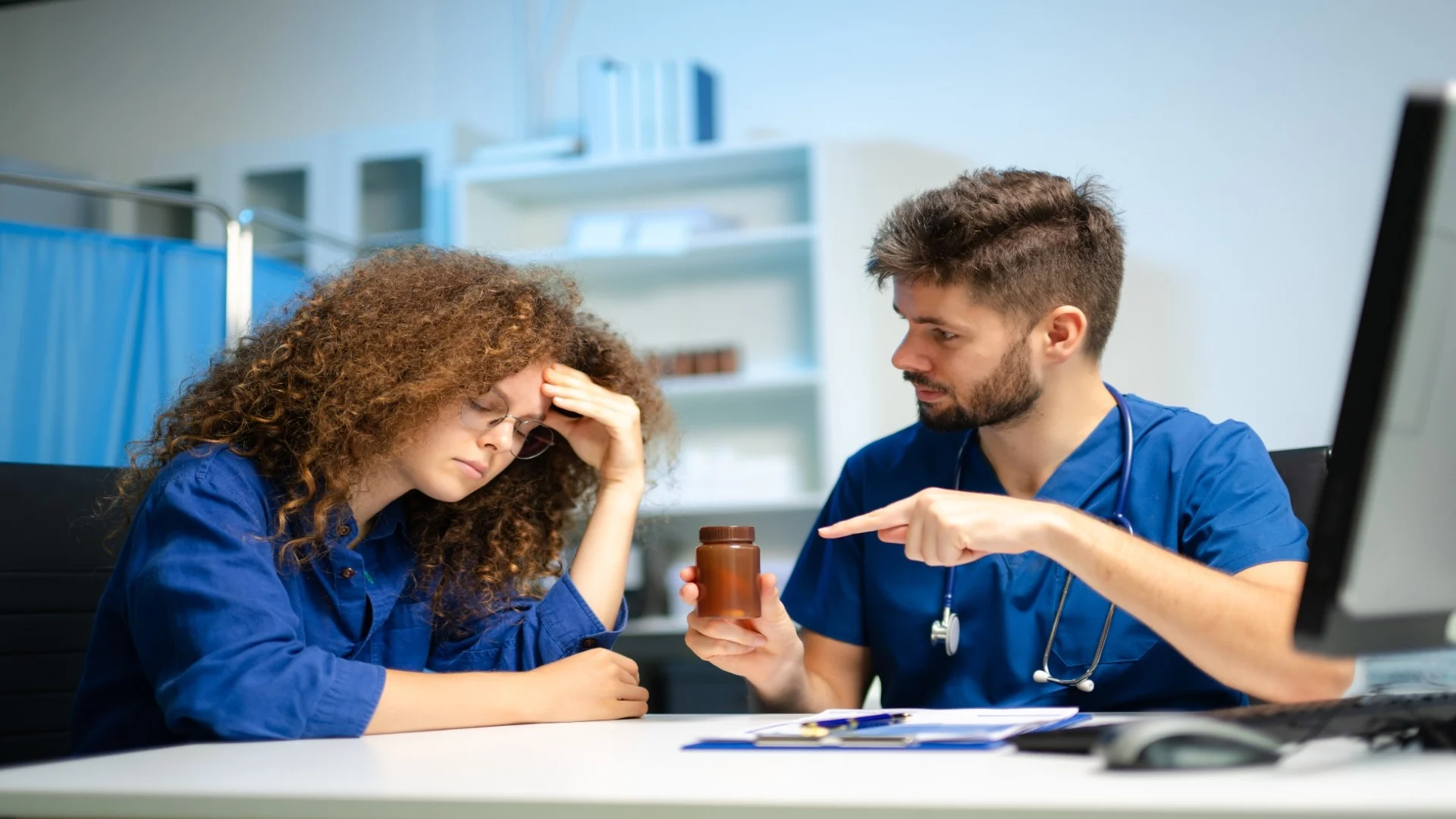 young-doctor-in-blue-scrubs-explains-medicine-usag-2025-06-10-08-26-40-utc