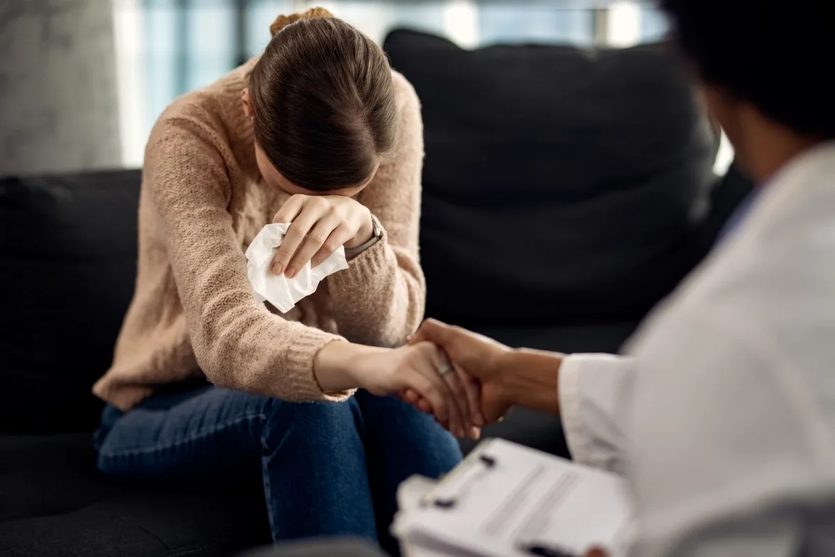 EMDR: Woman crying talking to her EMDR specialist