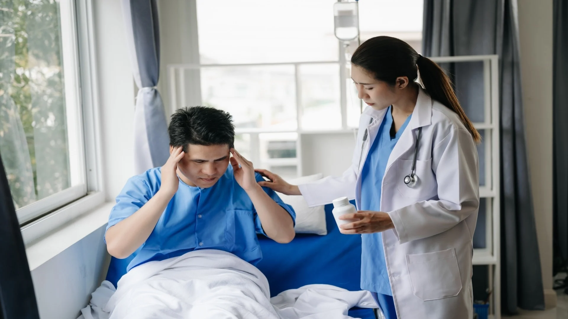 doctor-in-white-suit-take-notes-while-discussing-a-2024-11-01-23-12-20-utc