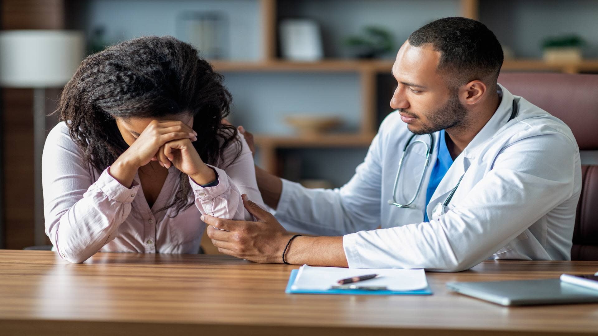 attentive-arabic-doctor-supporting-sad-black-woman-2025-03-18-18-12-56-utc