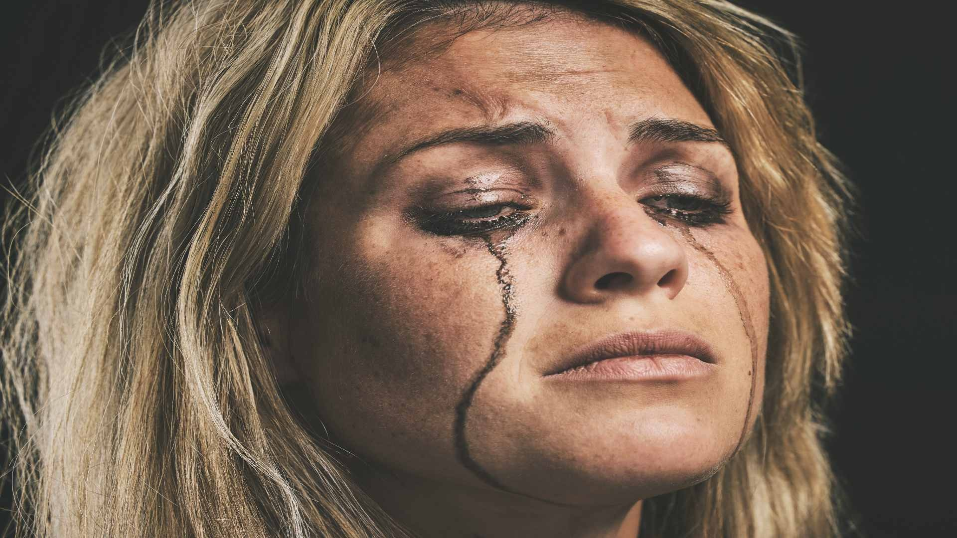 sad-depression-and-woman-crying-with-makeup-smudg-2025-04-06-08-01-09-utc
