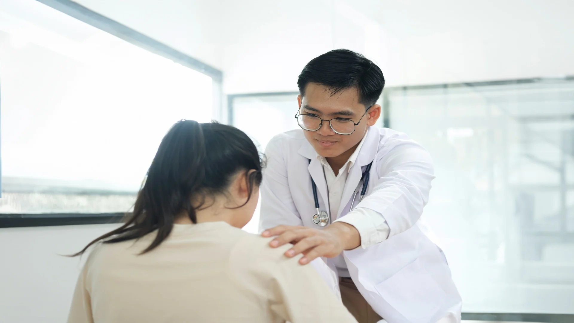 kind-doctor-offering-a-loving-gesture-to-a-sick-pe-2025-03-26-13-12-30-utc