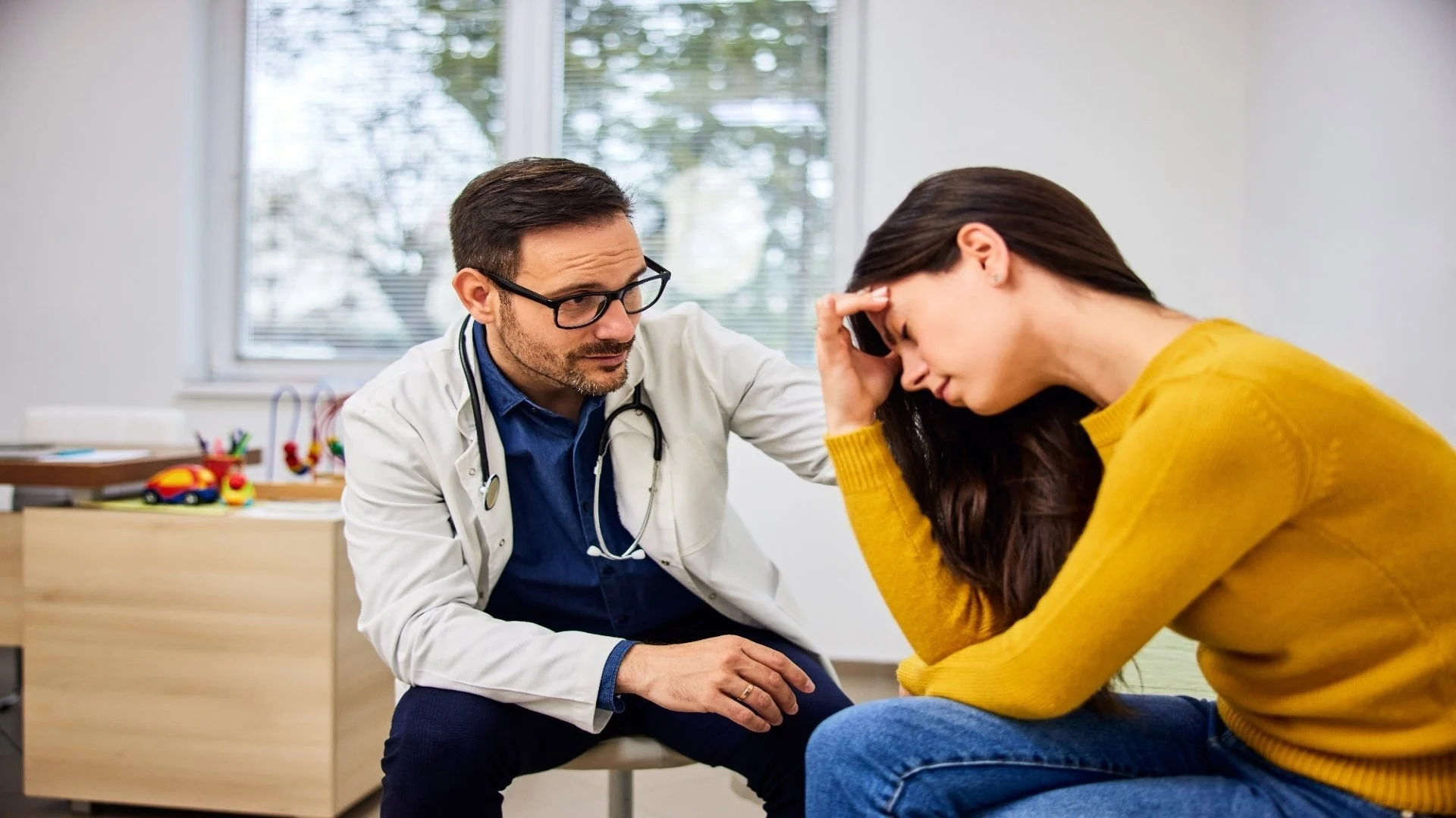 a-caring-male-pediatrician-console-a-worried-mothe-2025-08-27-23-28-48-utc