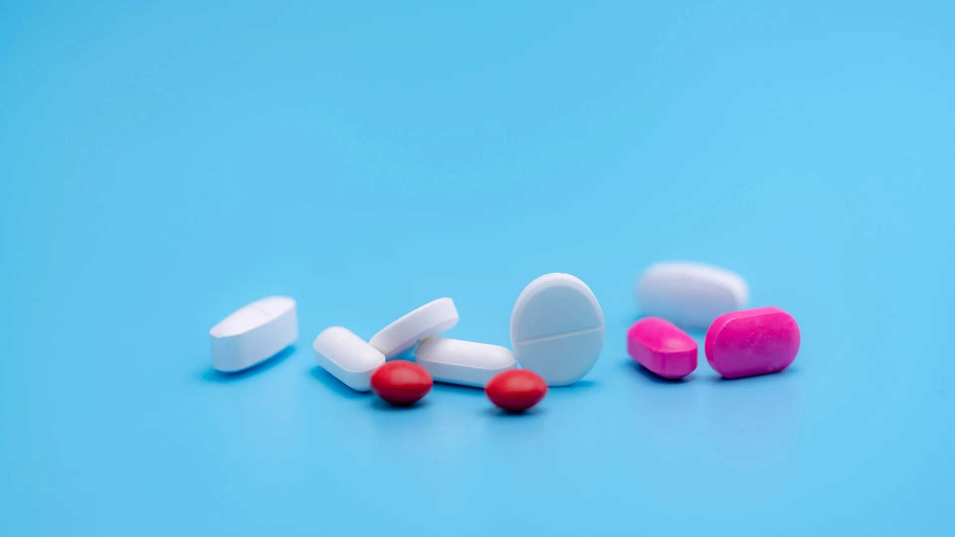 pharmacy-banner-white-and-pink-tablets-pills-on-b-2025-01-29-04-39-24-utc