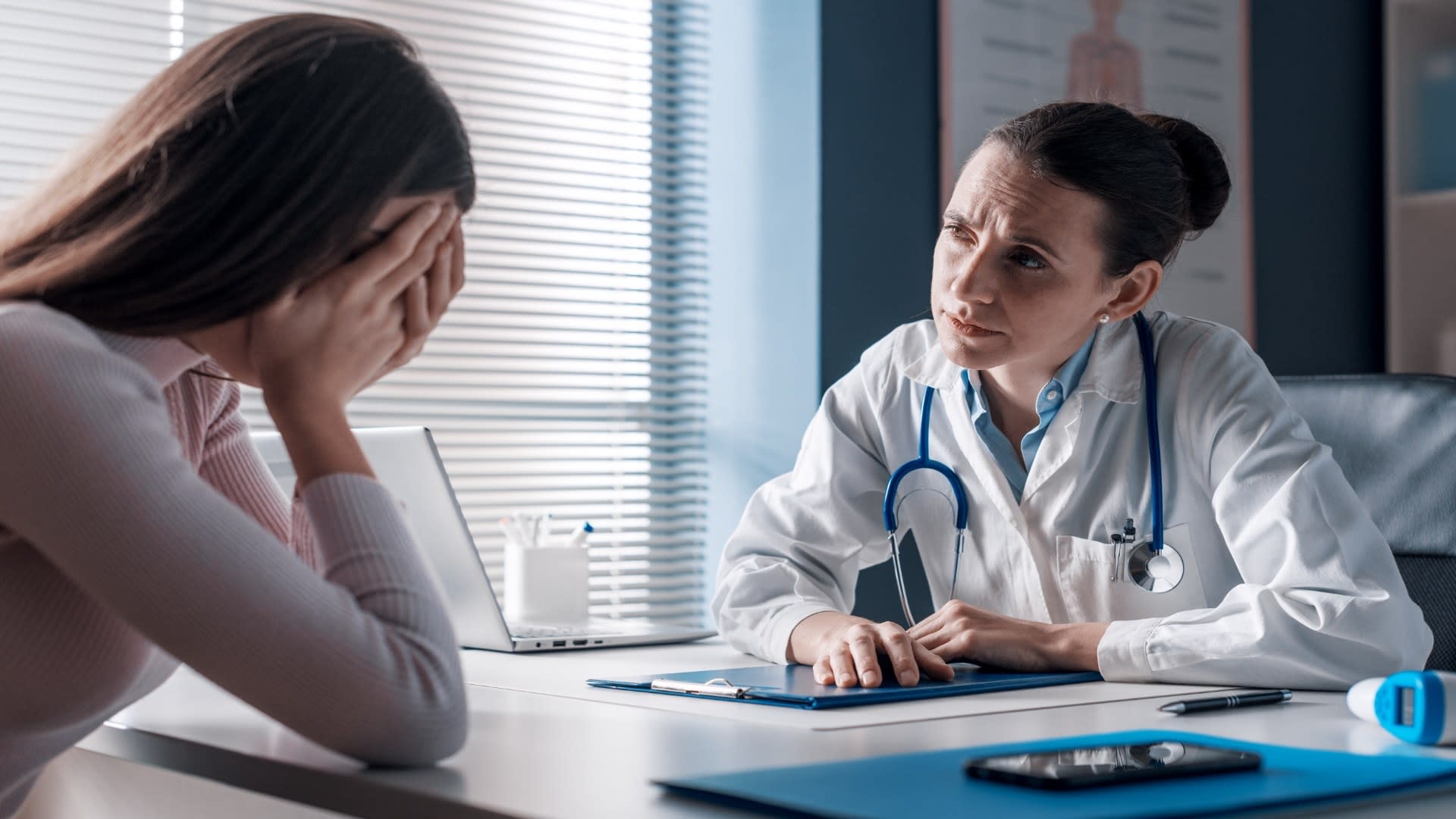 doctor-assisting-a-crying-patient-in-the-office-2025-01-08-15-16-17-utc