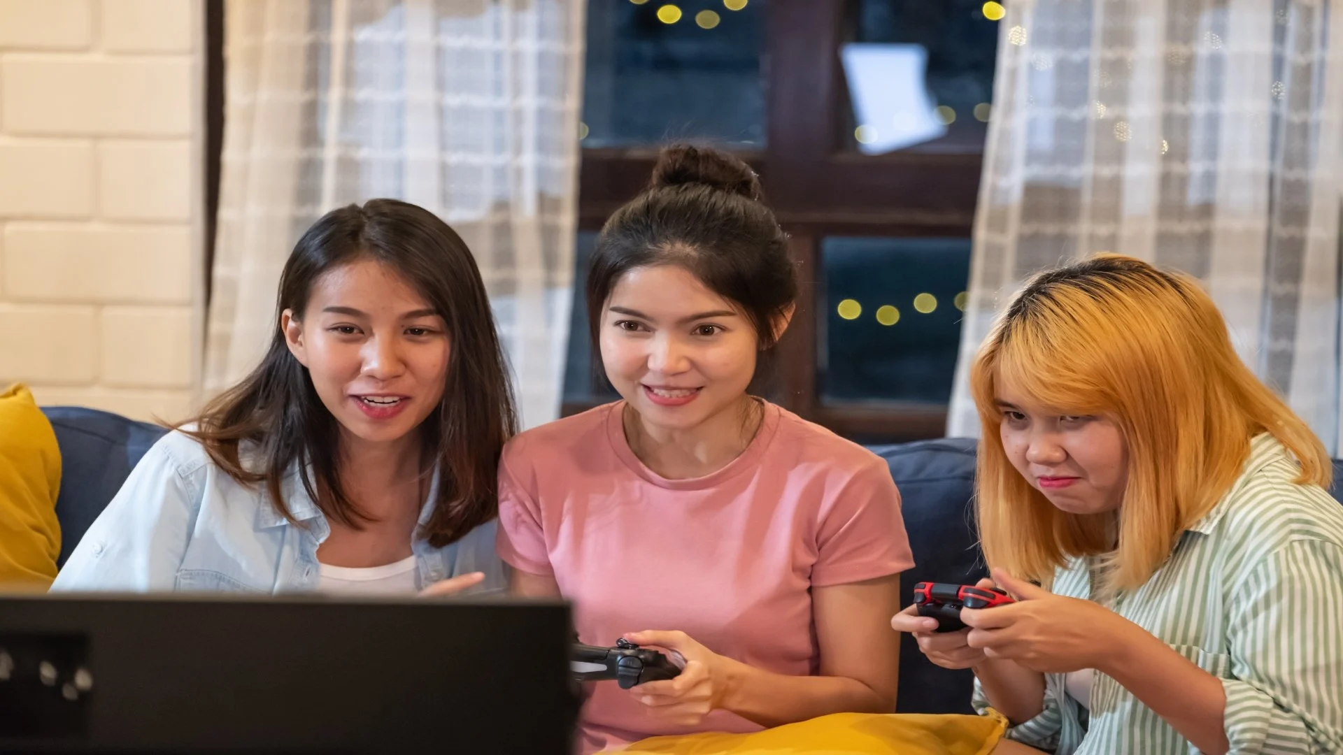 happy-friends-playing-game-on-sofa-at-home-nigth-t-2024-12-05-17-53-57-utc