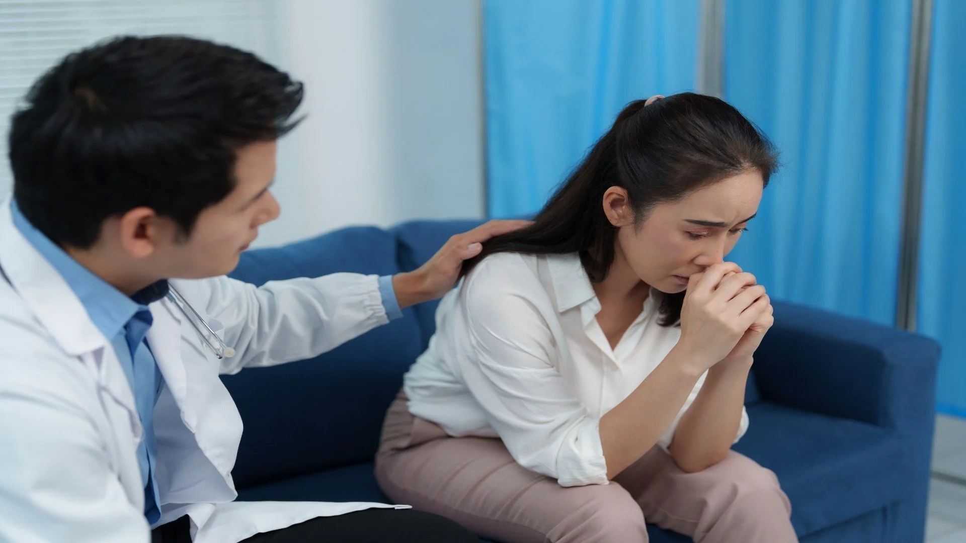 doctor-comforting-sad-patient-in-hospital-room-2025-05-23-20-18-44-utc