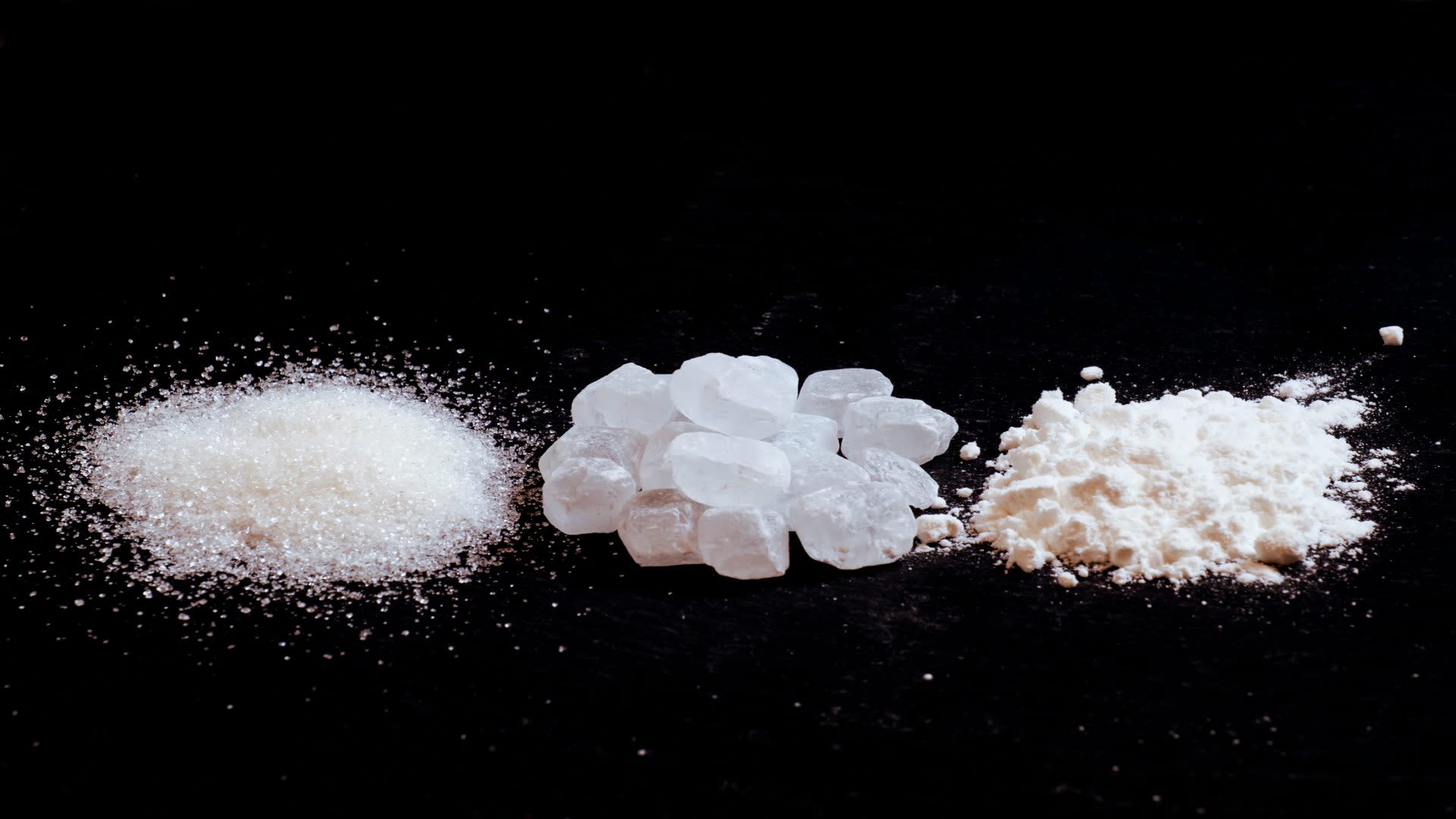 Several baggies containing various powders and granules, often associated with illegal drugs. Their presence is among the physical signs of meth use.