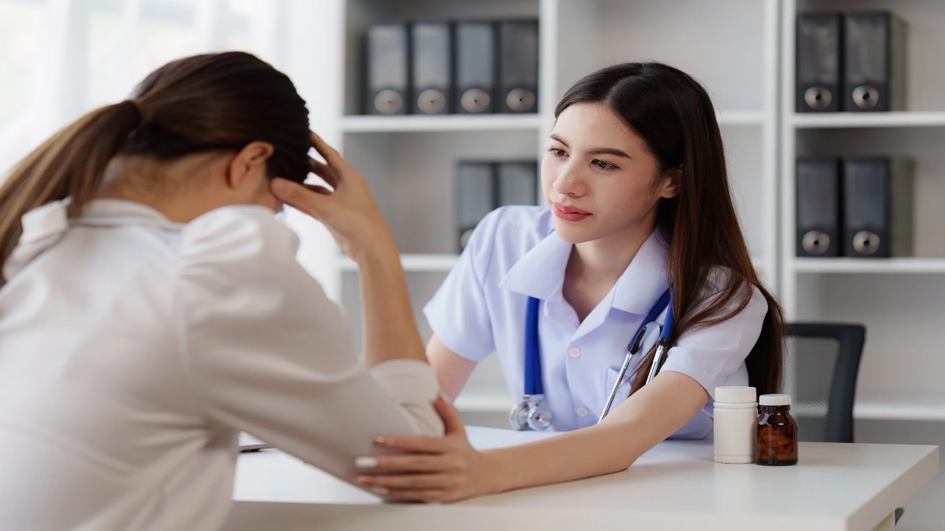 doctor-holding-hand-patient-woman-at-clinic-healt-2025-02-18-05-37-10-utc