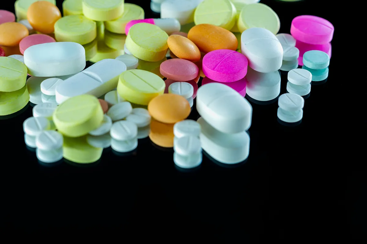 Synthetic Drug Addiction: Multi-colored pills in a pile Synthetic Drug Addiction: Multi-colored pills in a pile