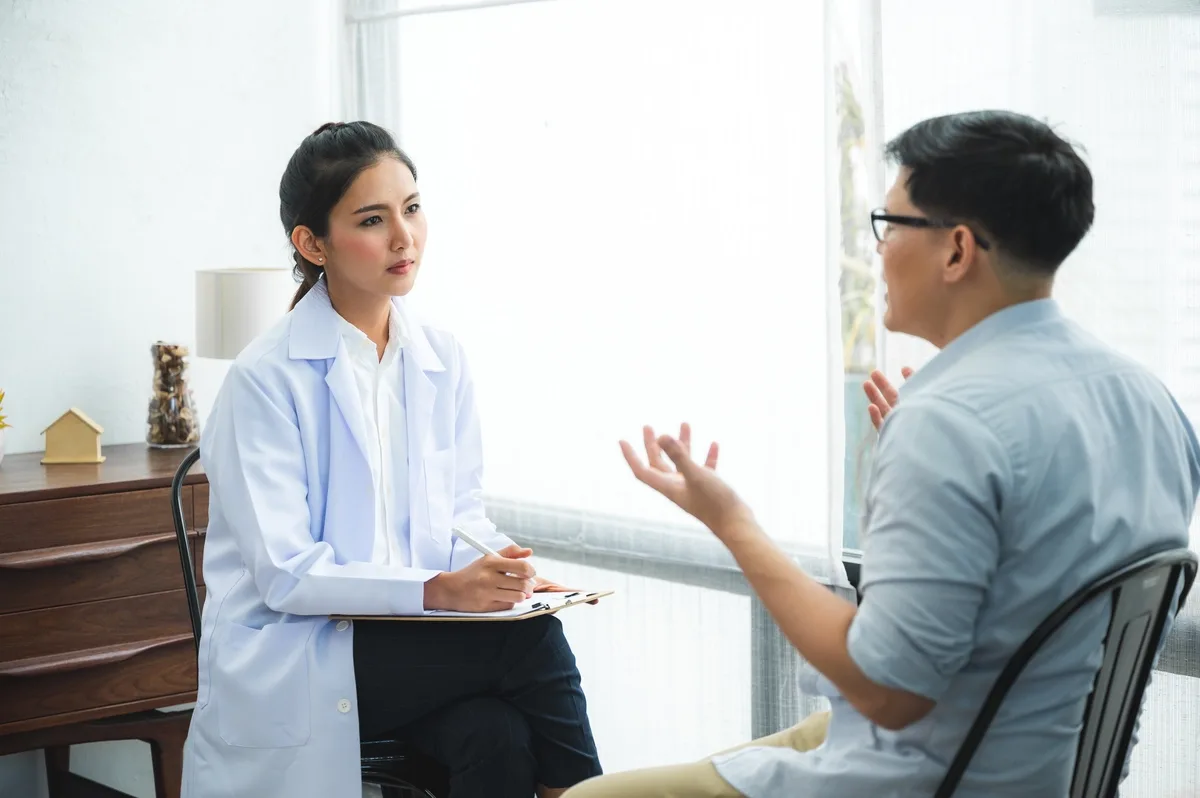 Case Management: Male patient explaining situation to case manager
