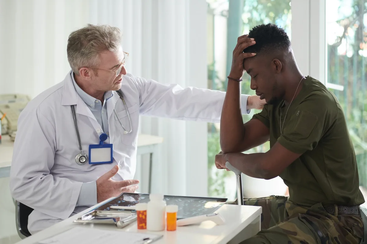 Therapist Comforting PTSD Veteran