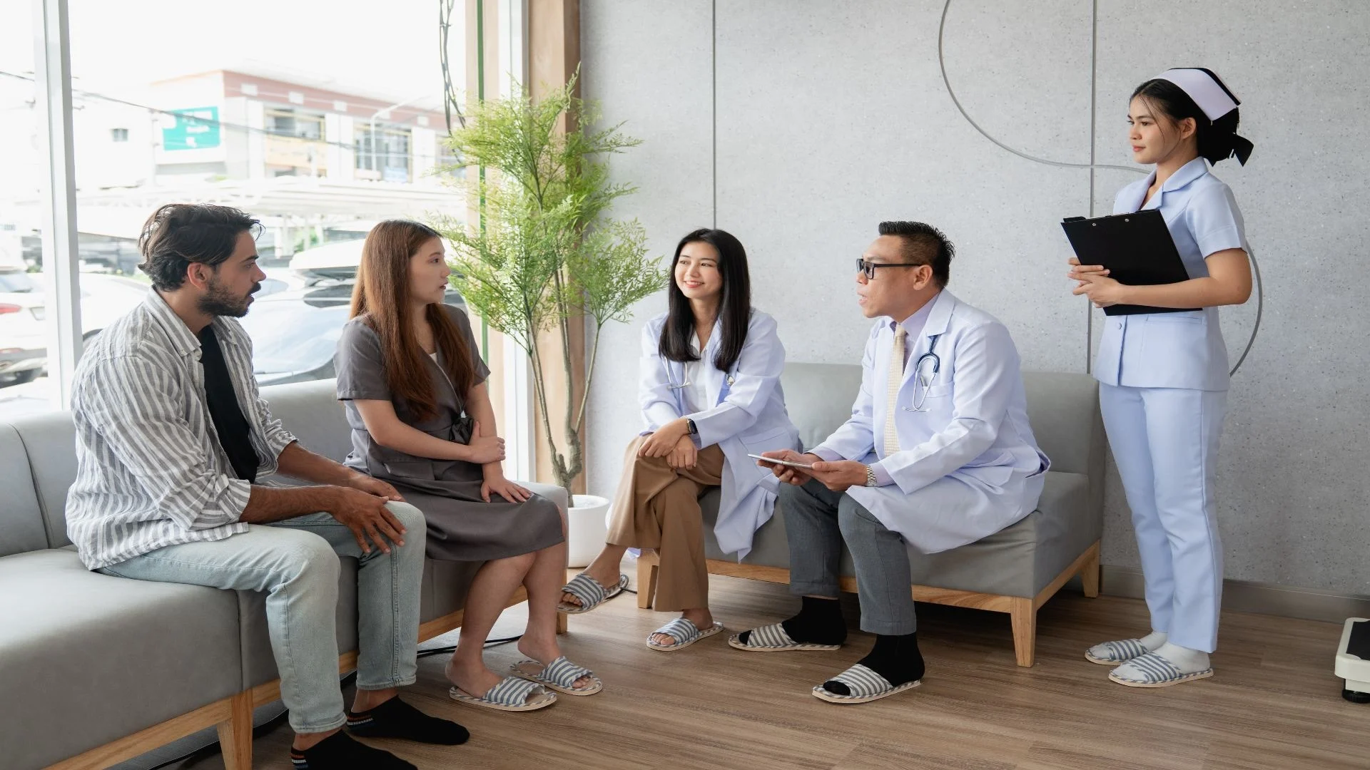 a-compassionate-doctor-and-nurse-assist-a-couple-w-2025-05-07-18-24-58-utc