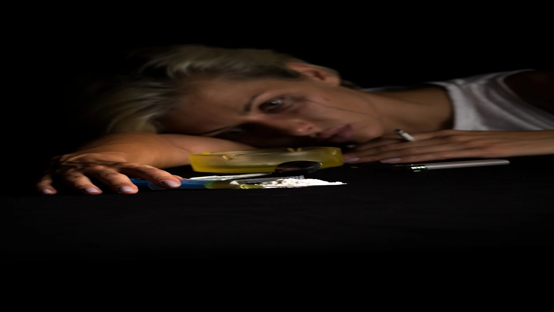 young-female-drug-addict-on-black-background-2025-01-29-08-23-59-utc