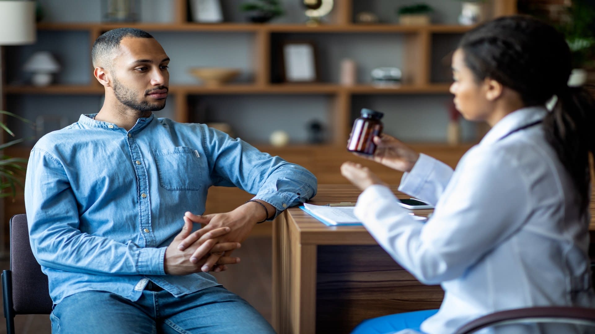 african-american-doctor-showing-black-guy-patient-2025-03-18-18-01-33-utc
