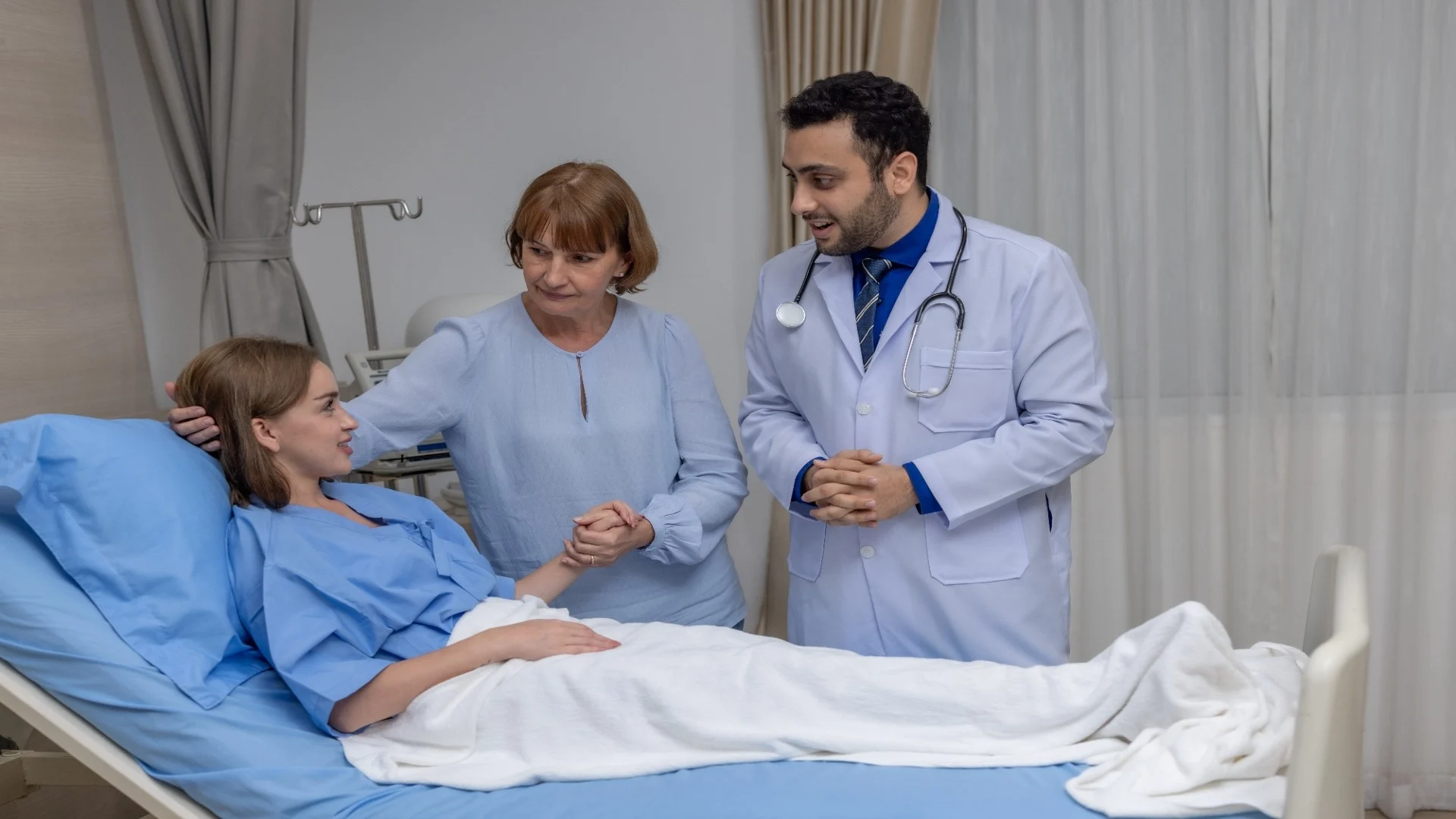 doctor-and-mother-supporting-hospitalized-patient-2025-01-09-22-12-19-utc