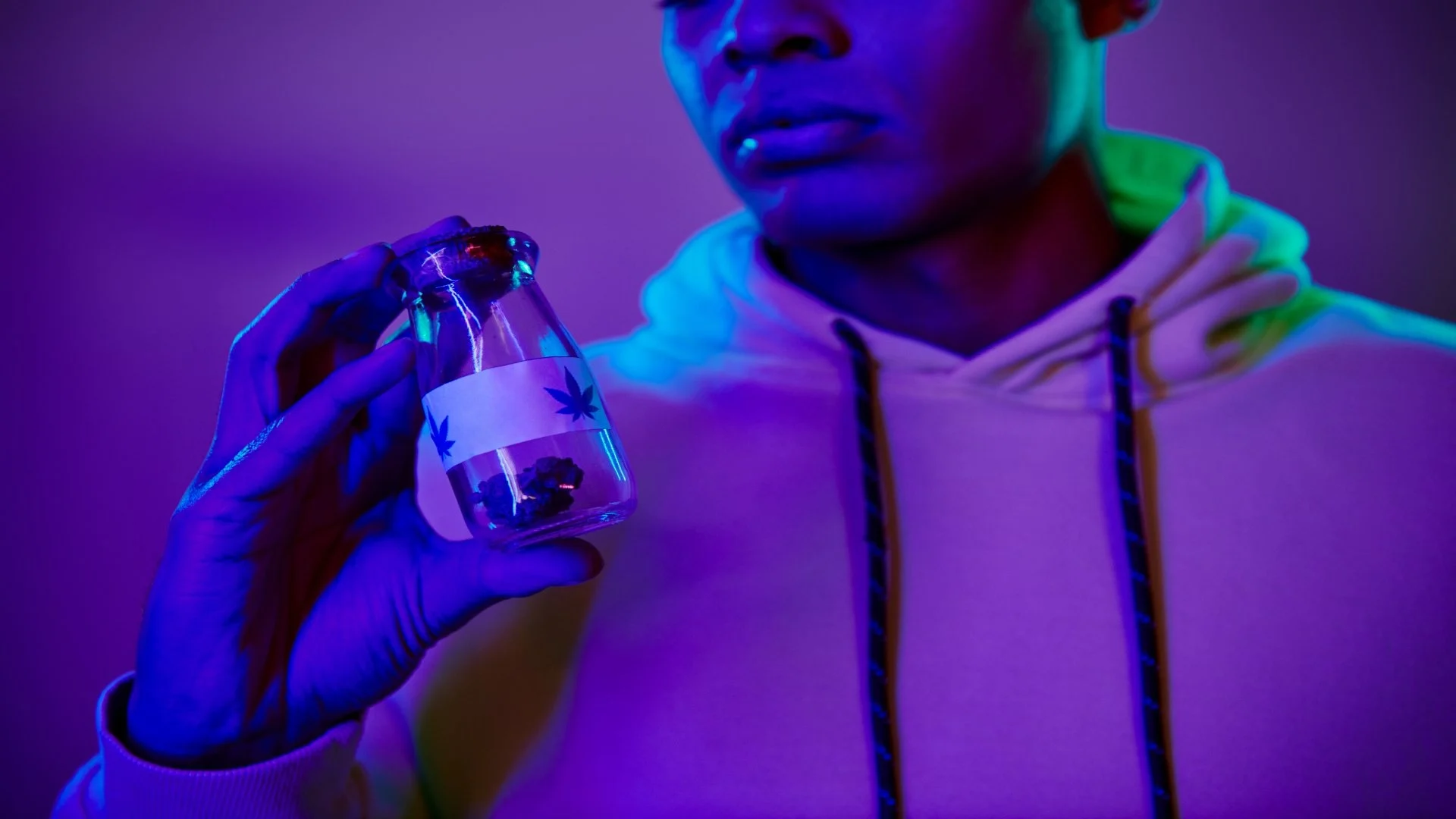 cropped-african-american-man-in-hoodie-holding-jar-2024-11-11-21-33-02-utc